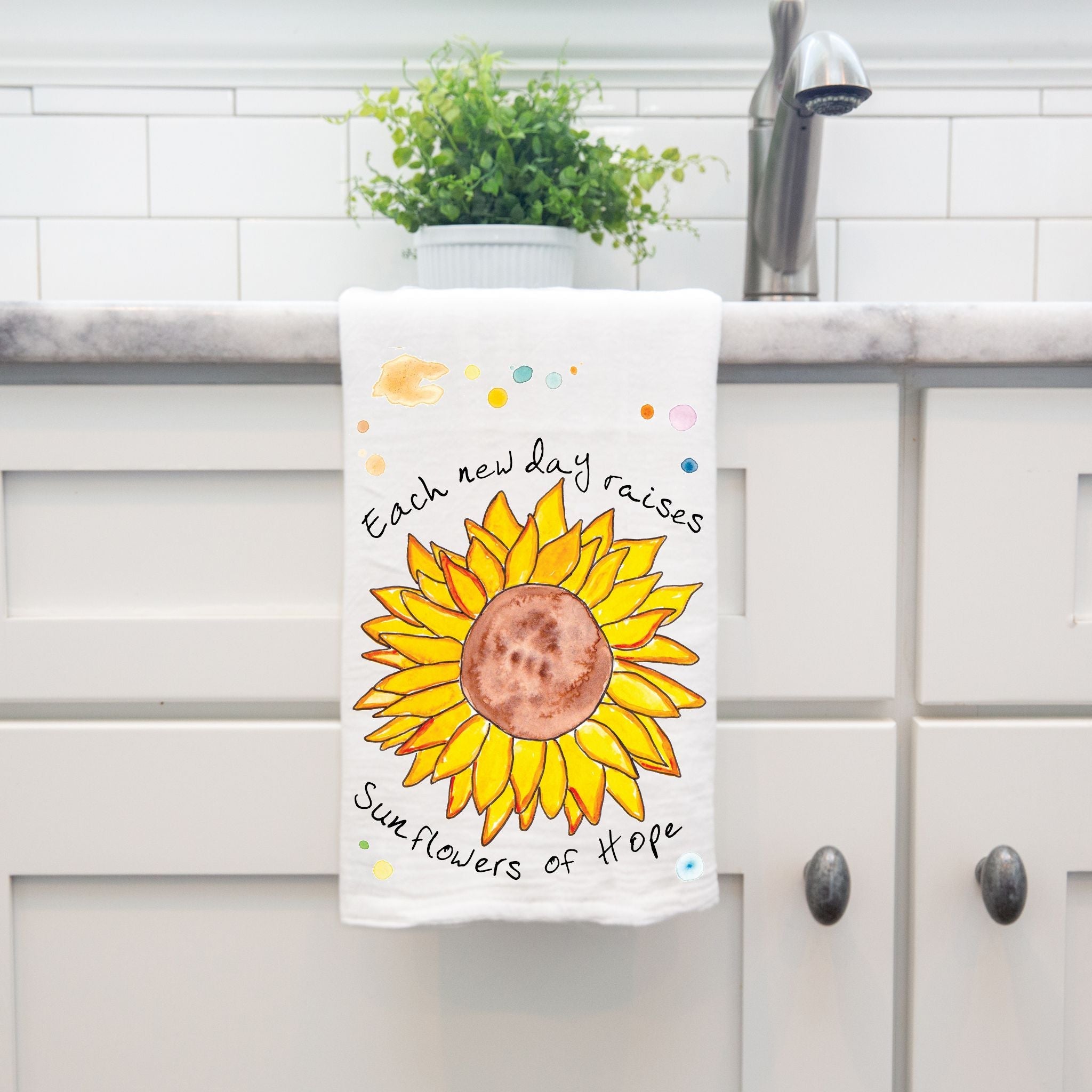 Sunflowers of Hope dish towel hanging in the kitchen