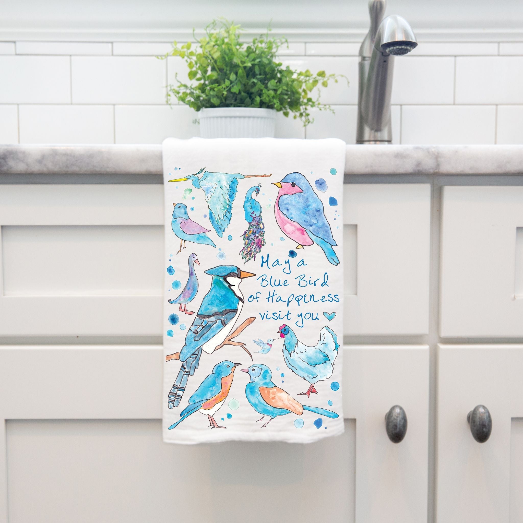 Blue Birds of Happiness dish towel hanging by kitchen sink