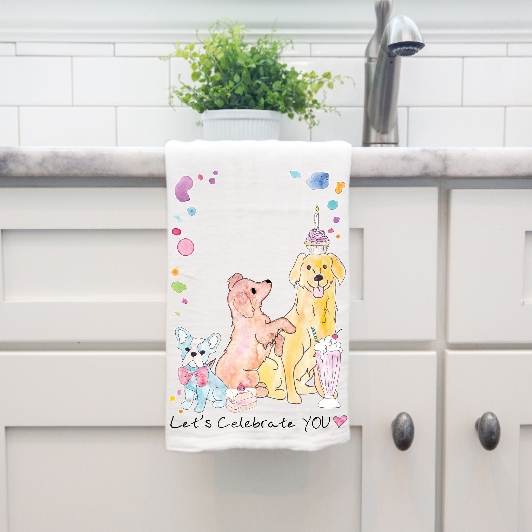 Celebrate Your Birthday dish towel hanging by kitchen sink