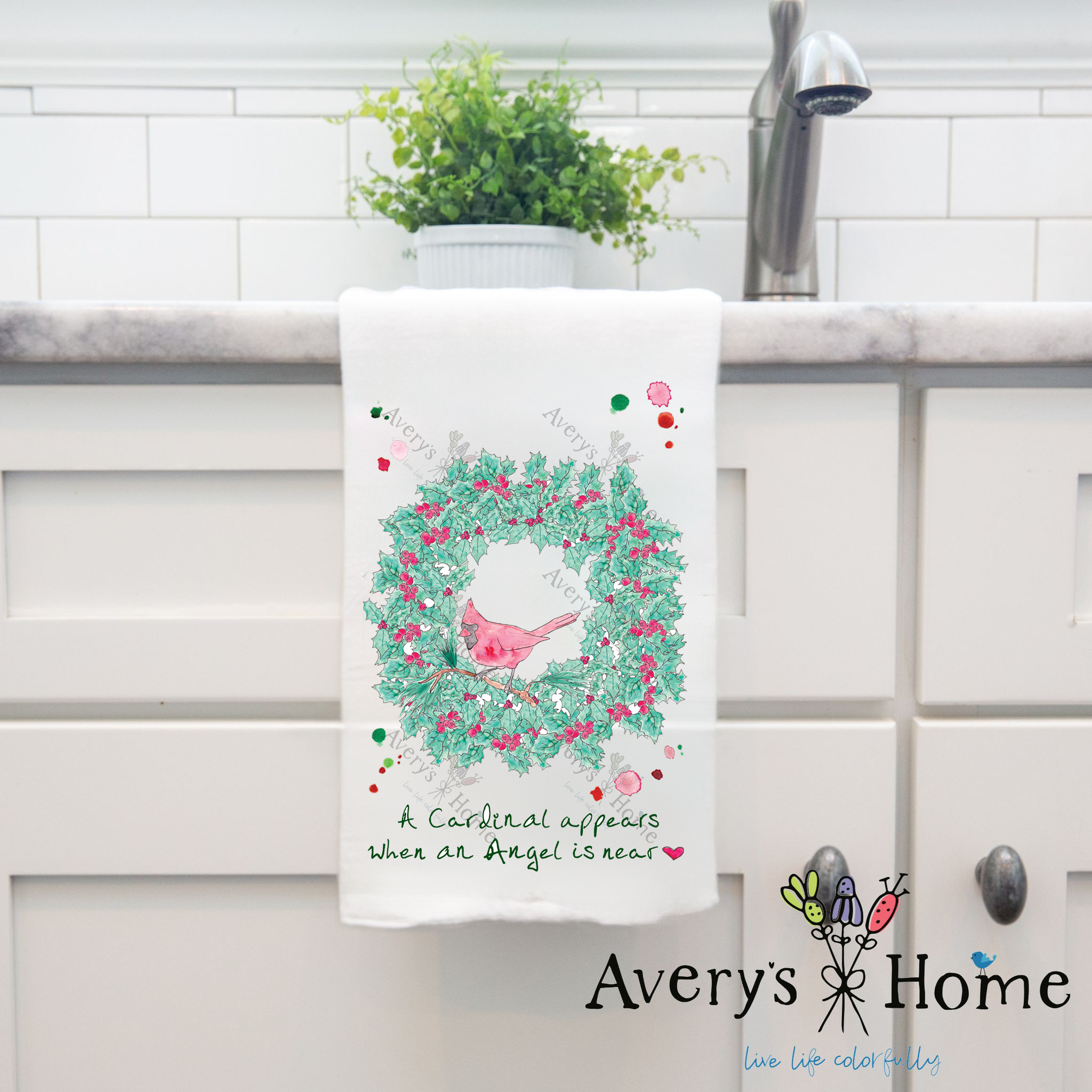Cardinals Appear Christmas Wreath dish towel hanging by kitchen sink