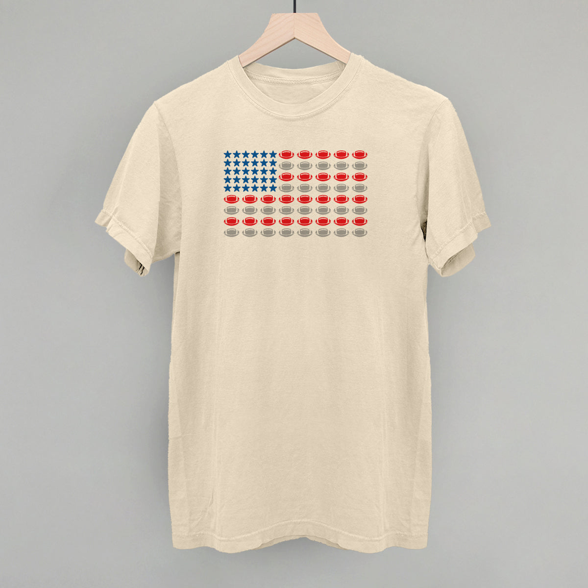 Football American flag design on an ivory Comfort Colors tee