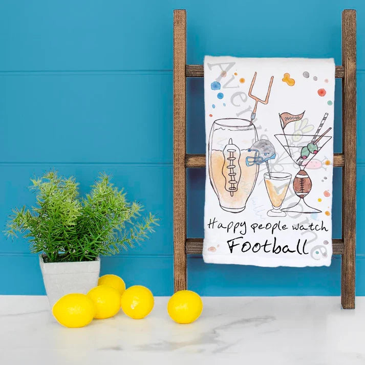 Happy People Watch Football dish towel hanging in the kitchen