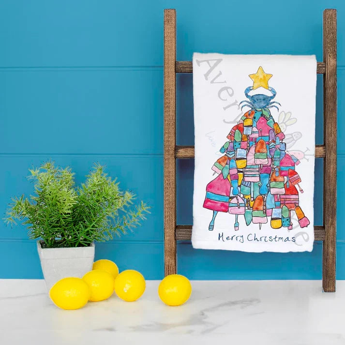 Crab and Buoys Christmas Tree dish towel hanging in the kitchen