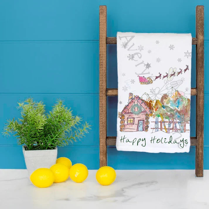 Happy Holidays in the Mountains dish towel hanging in the kitchen