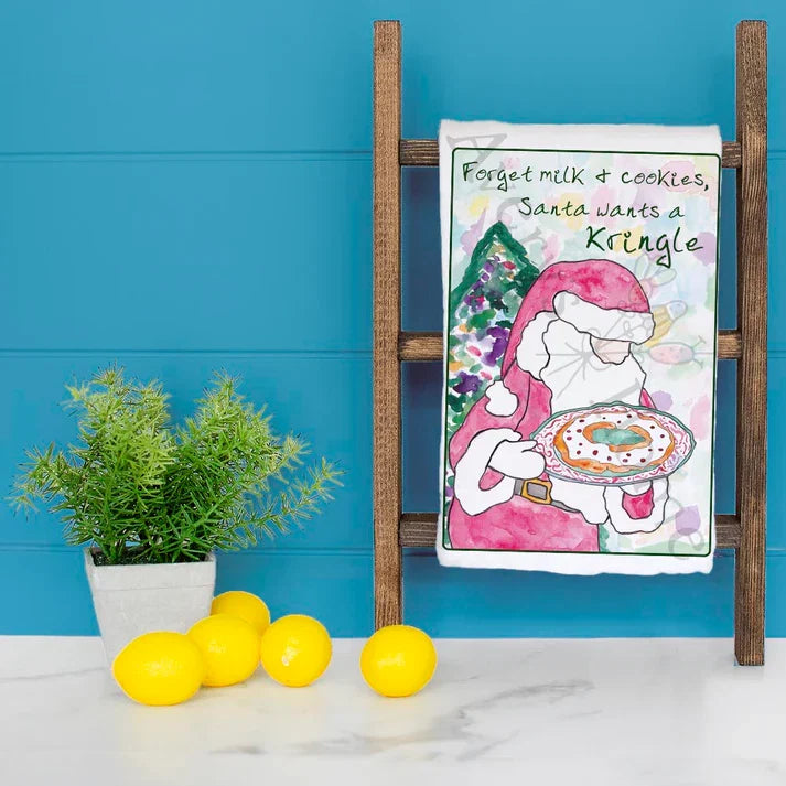 Santa Wants a Kringle Christmas dish towel hanging in the kitchen