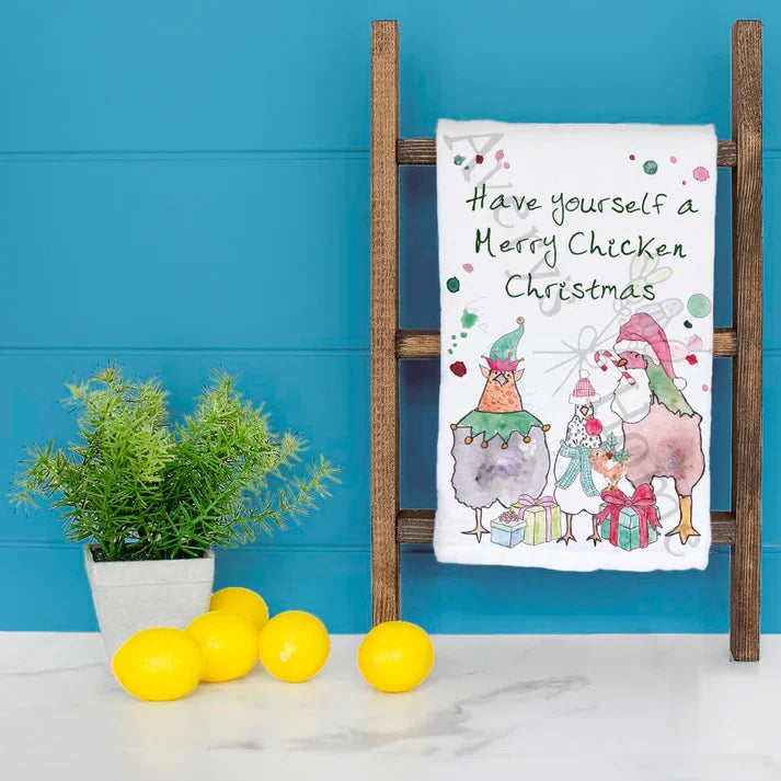 Merry Chicken Christmas dish towel hanging in the kitchen