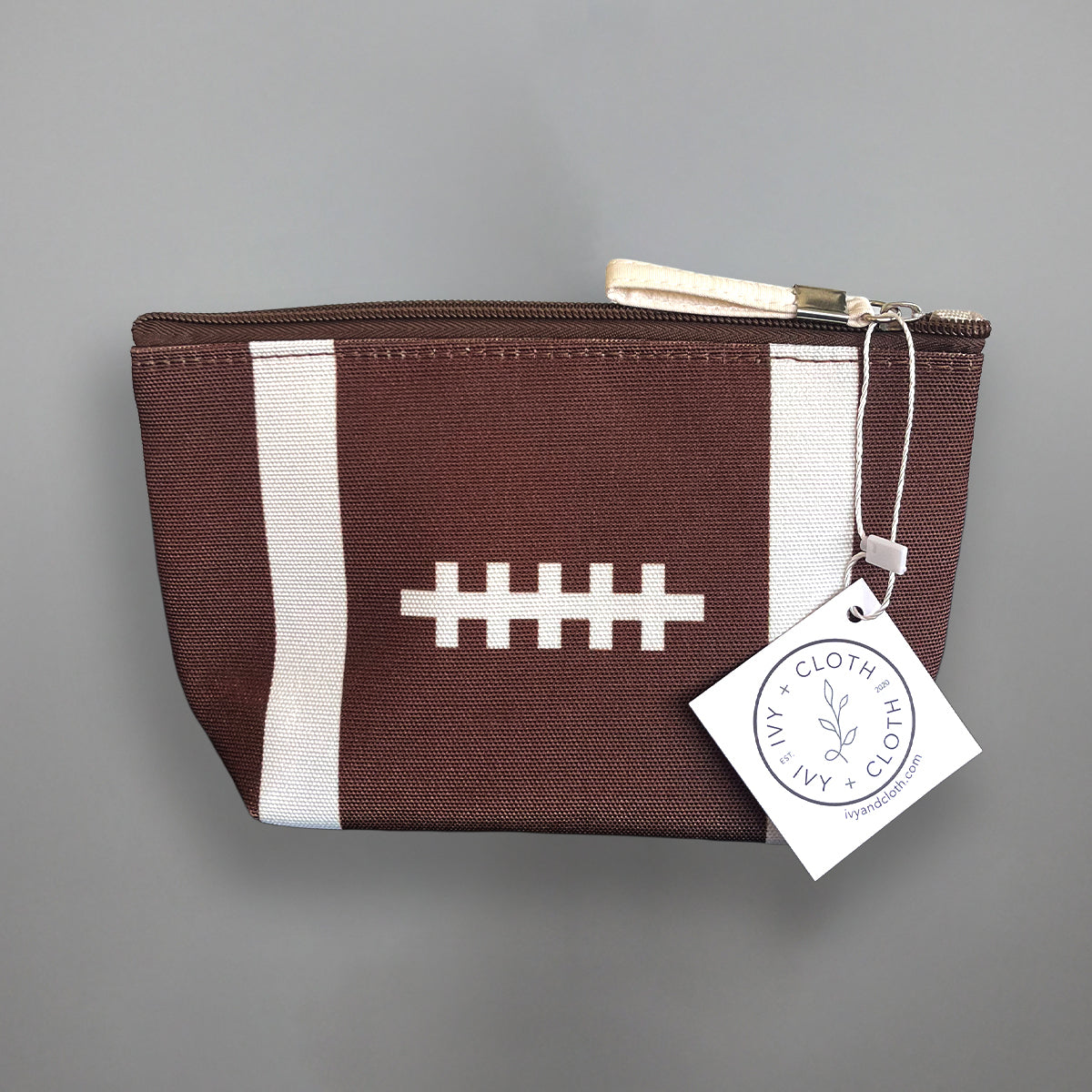 Football zip pouch sized for a stadium bag