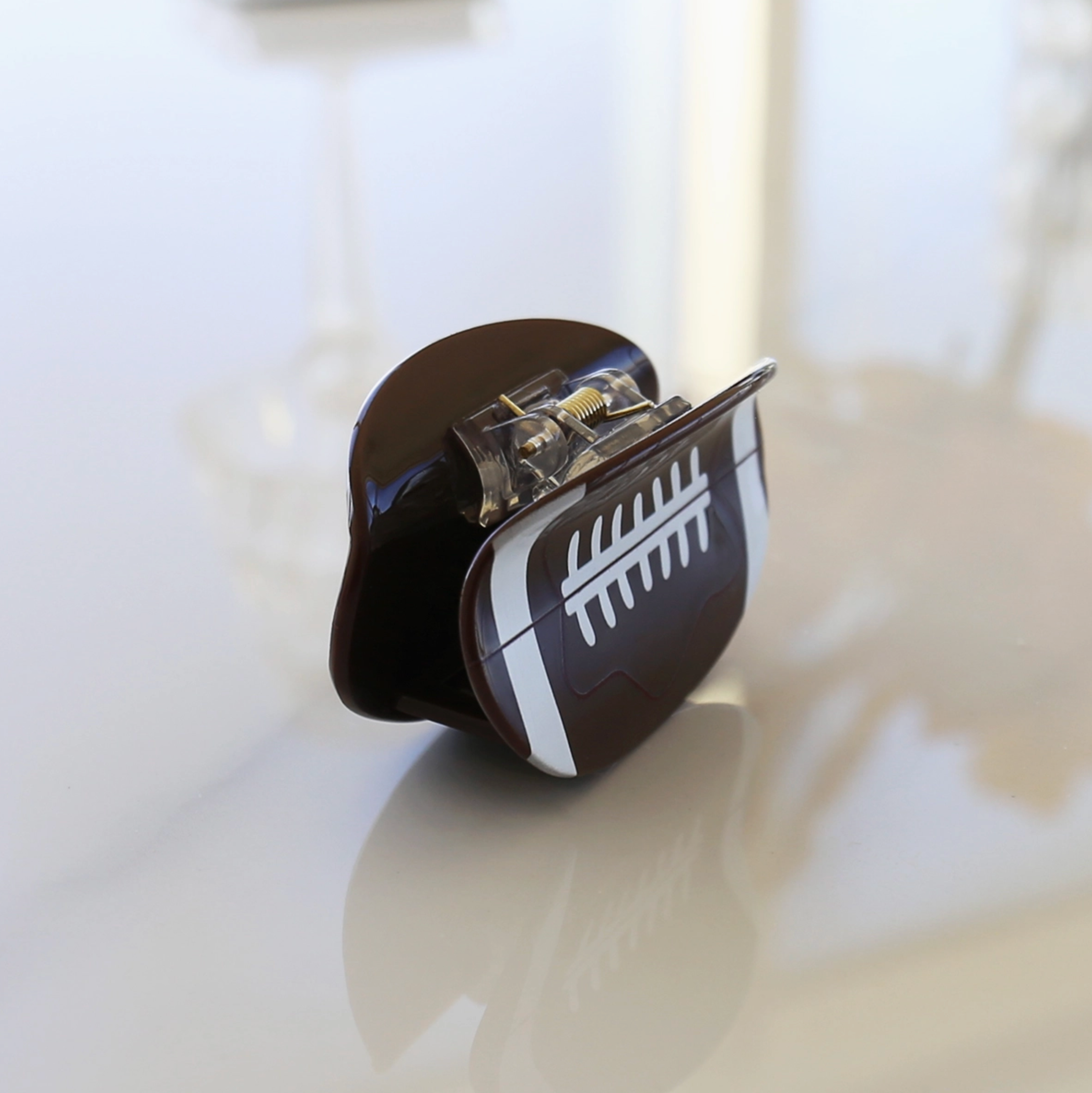 Football claw clip shown from the side to show the claw and hold