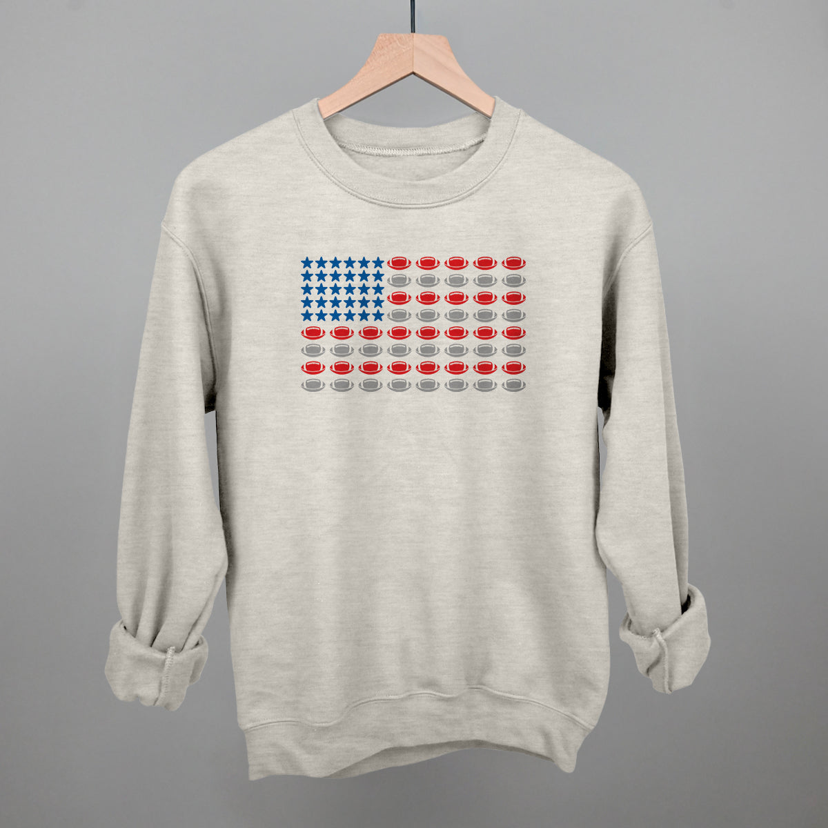 Football American flag design on an oatmeal crewneck sweatshirt