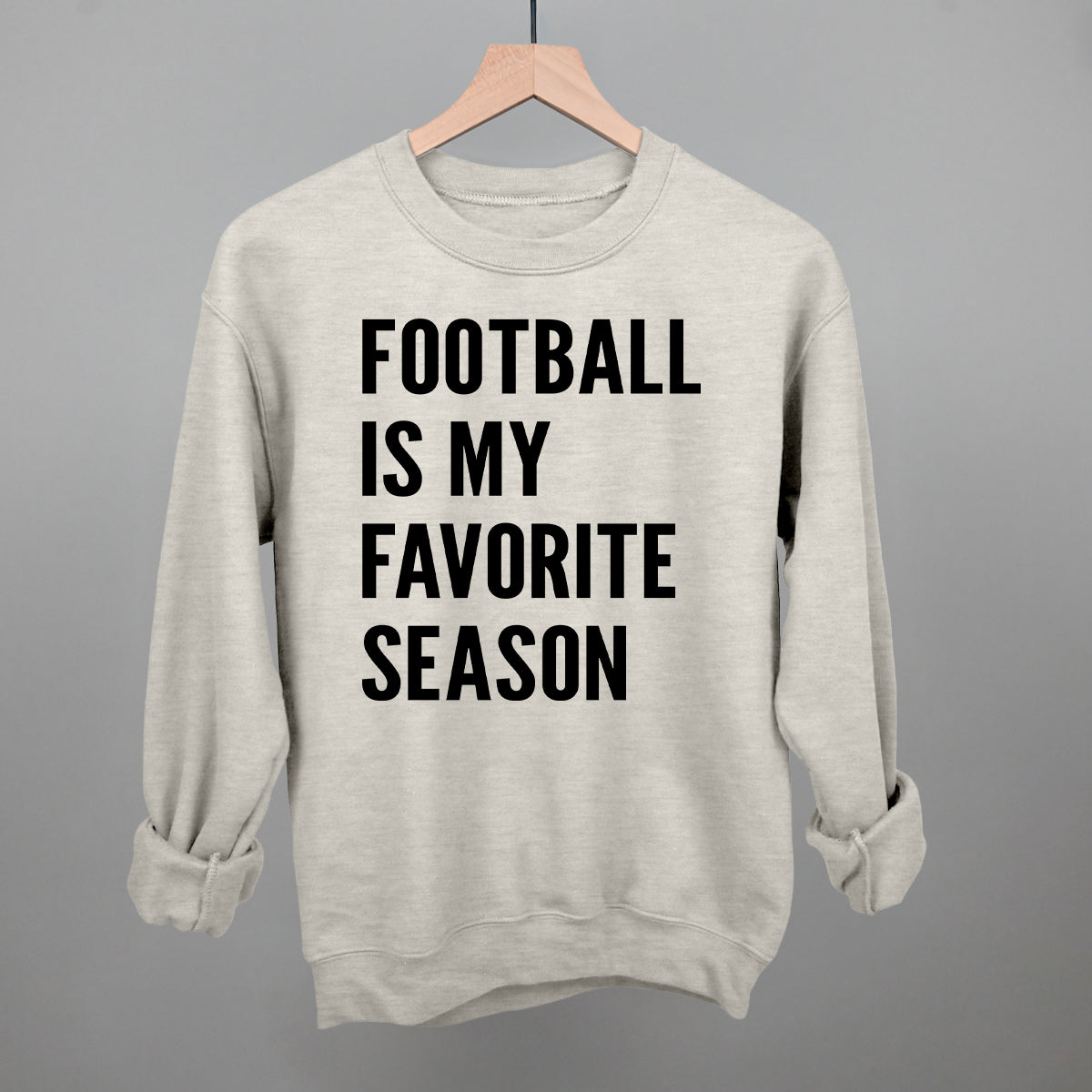 Football Is My Favorite Season design on an oatmeal heather crewneck sweatshirt