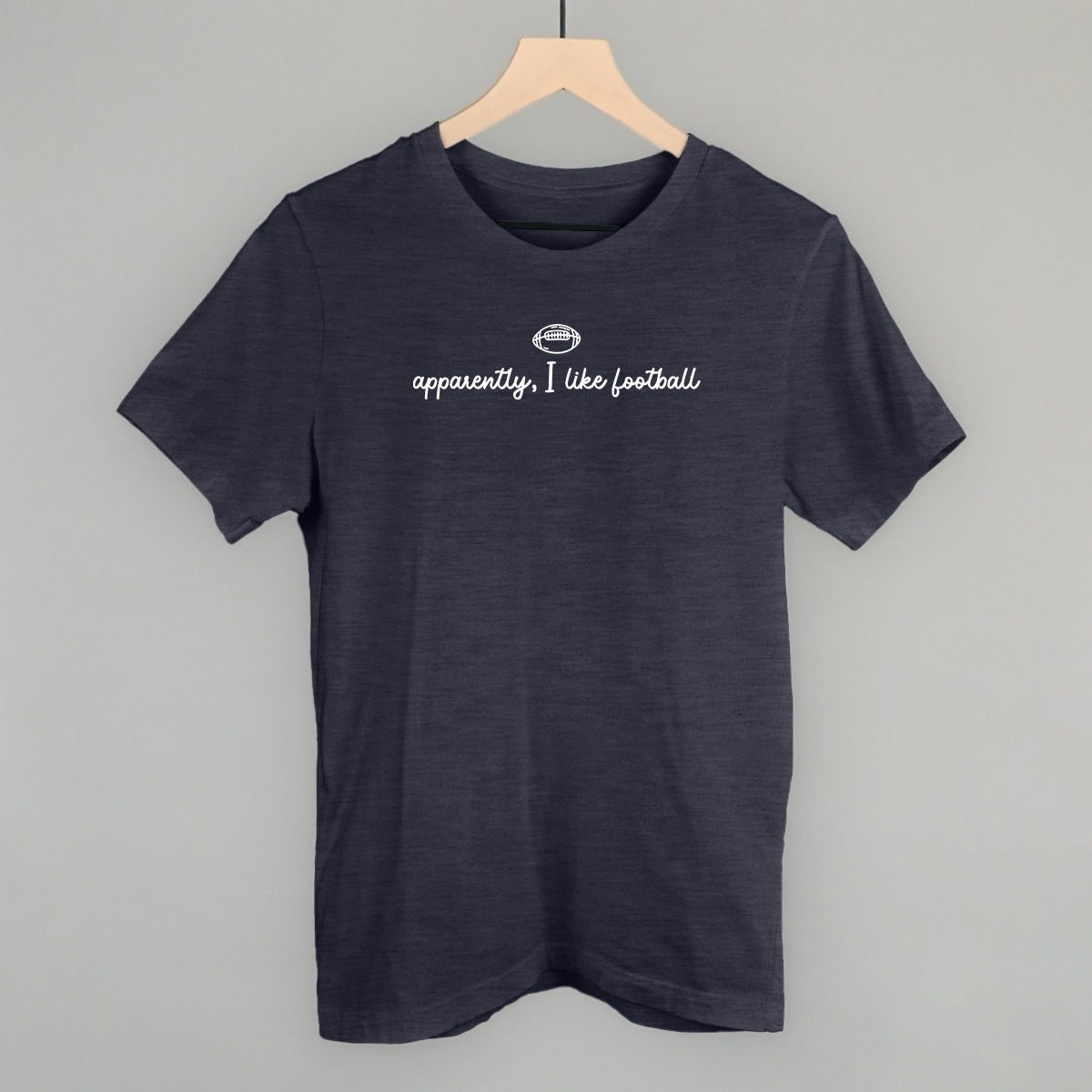 Apparently I Like Football design on a heather navy cotton tee