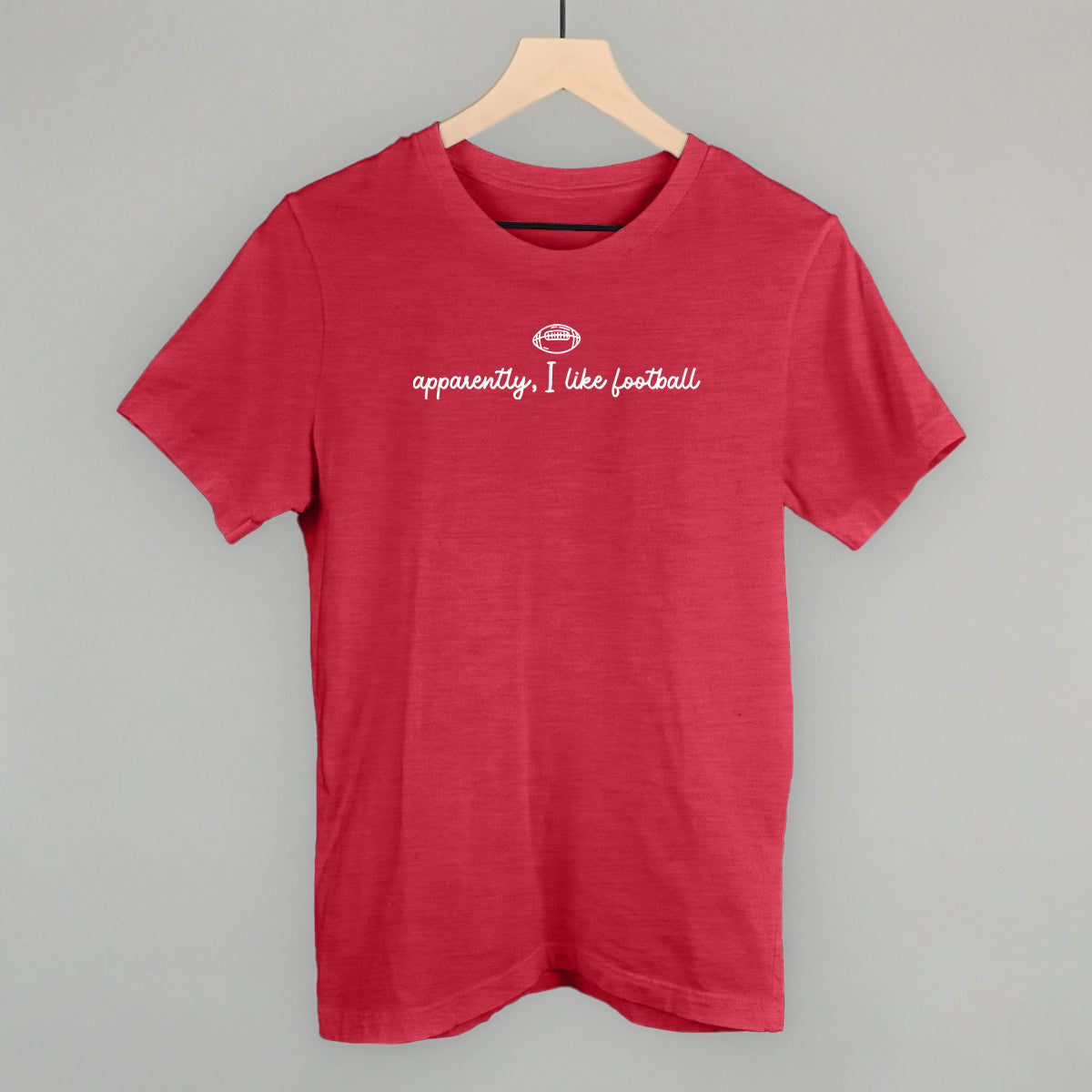 Apparently I Like Football design on a heather red cotton tee