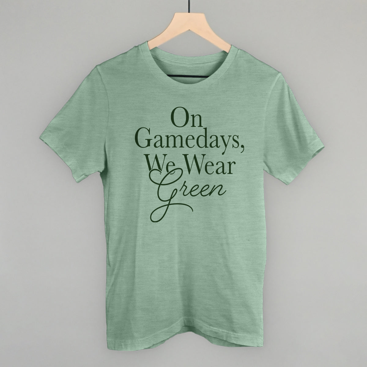 On Gamedays We Wear Green design on a heather sage cotton tee
