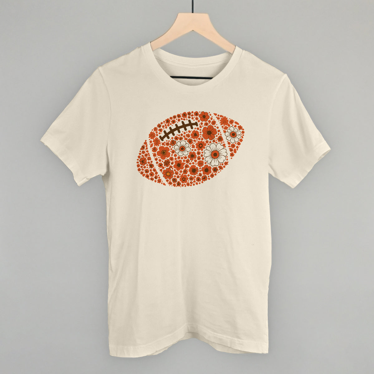 Orange floral football design on a natural cotton tee