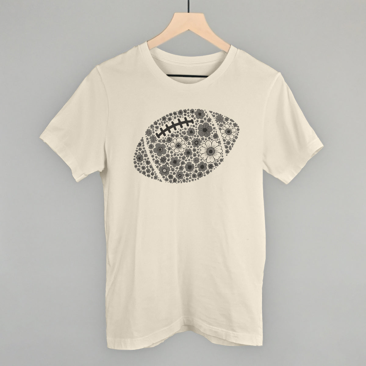 Grey floral football design on a natural cotton tee