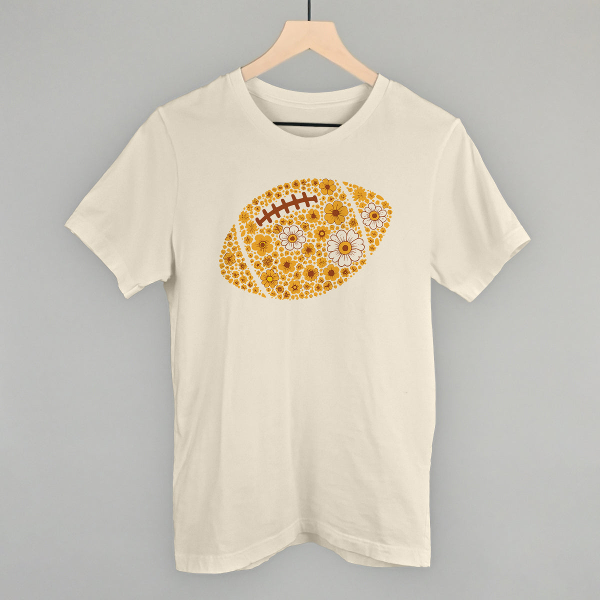Yellow floral football design on a natural cotton tee