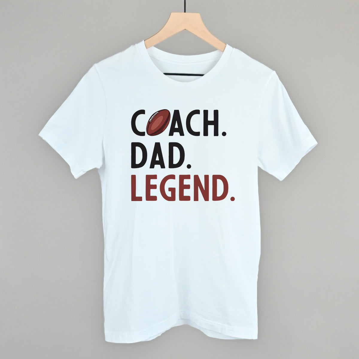 Coach Dad Legend football design on a white cotton tee