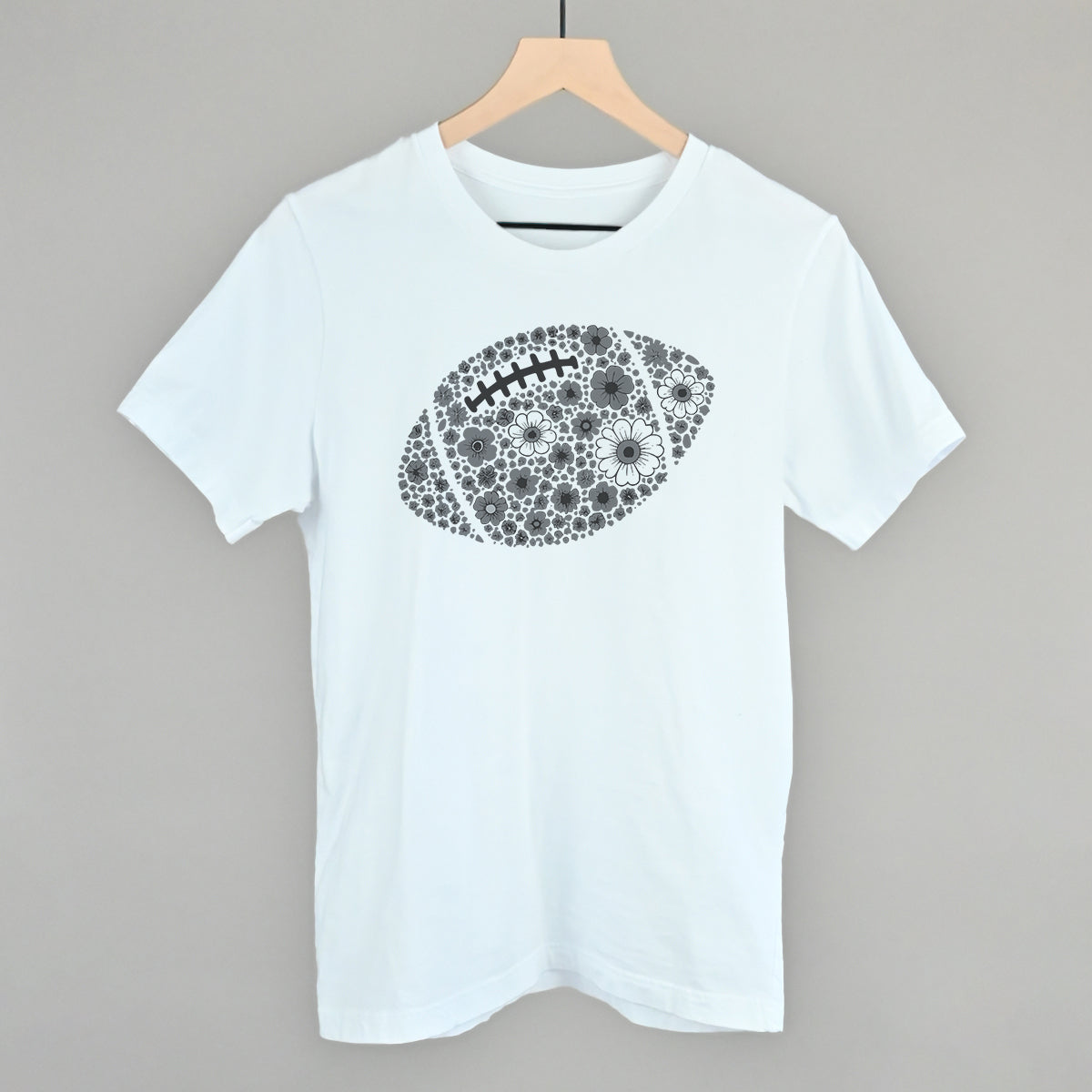 Grey floral football design on a white cotton tee