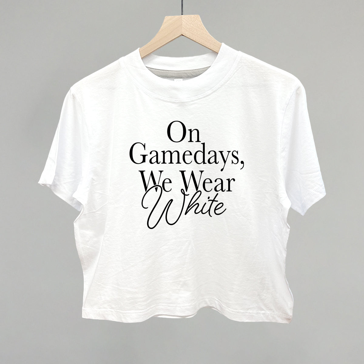 On Game Days We Wear White design on a white boxy tee