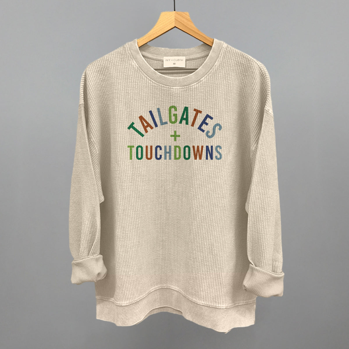 Tailgates And Touchdowns design on a moonbeam oversized corded crew