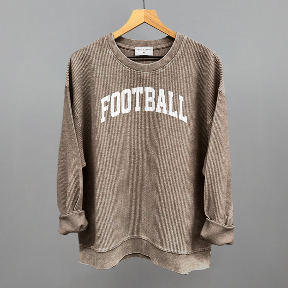 Football arch in white print on a pine bark oversized corded crew