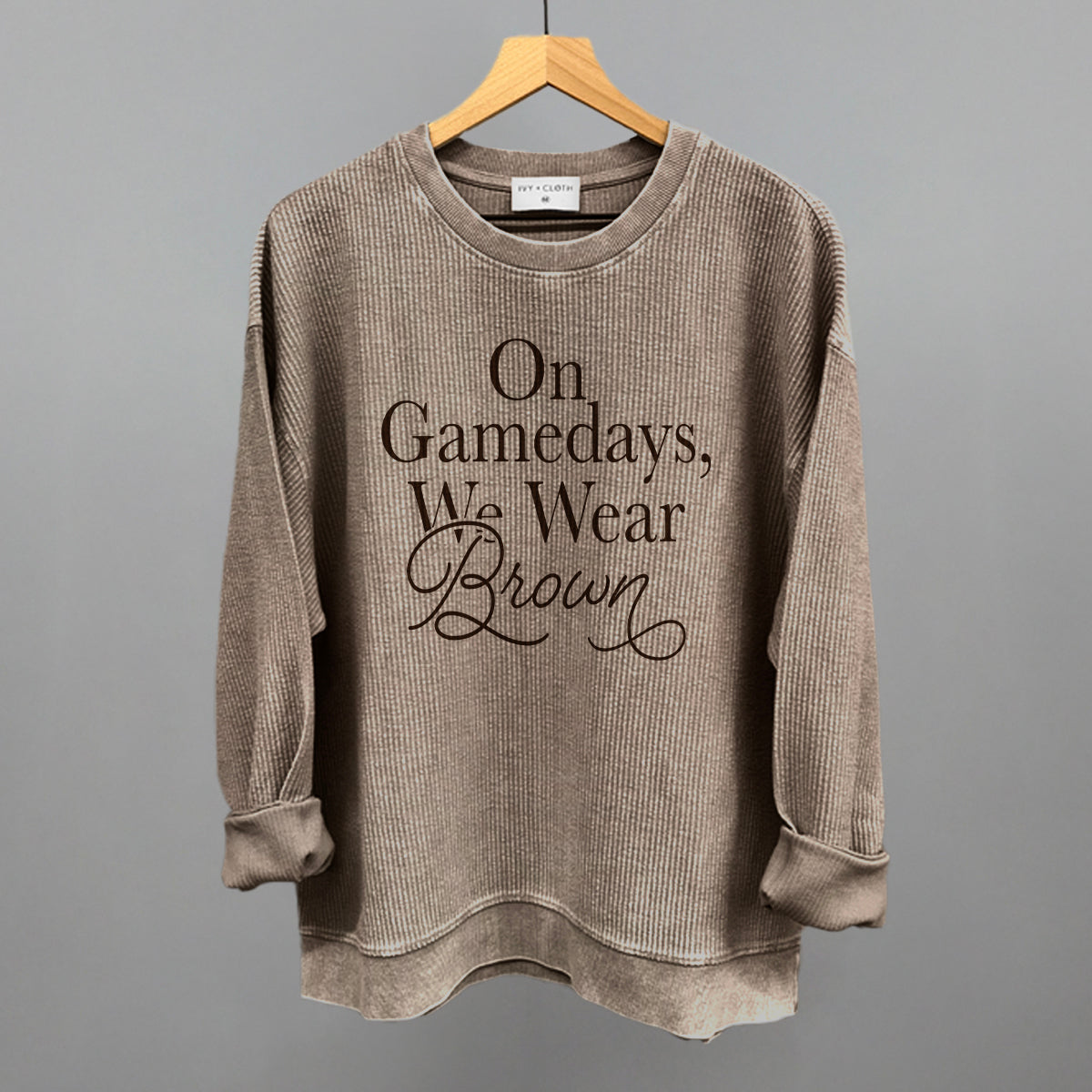 On Game Days We Wear Brown design on a pine bark oversized corded crew