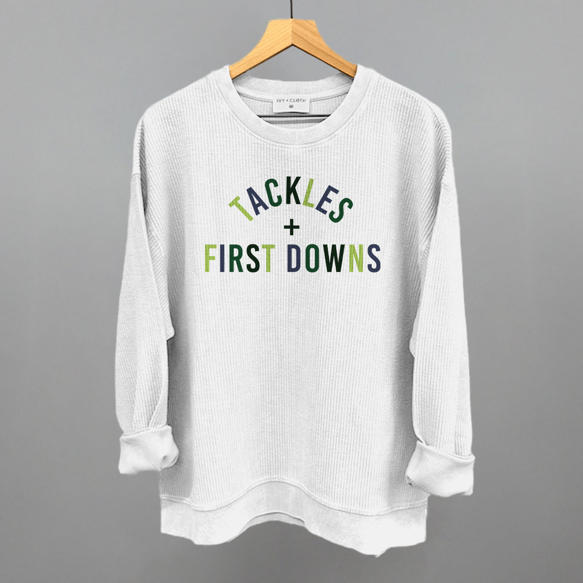 Tackles And First Downs design on a white oversized corded crew