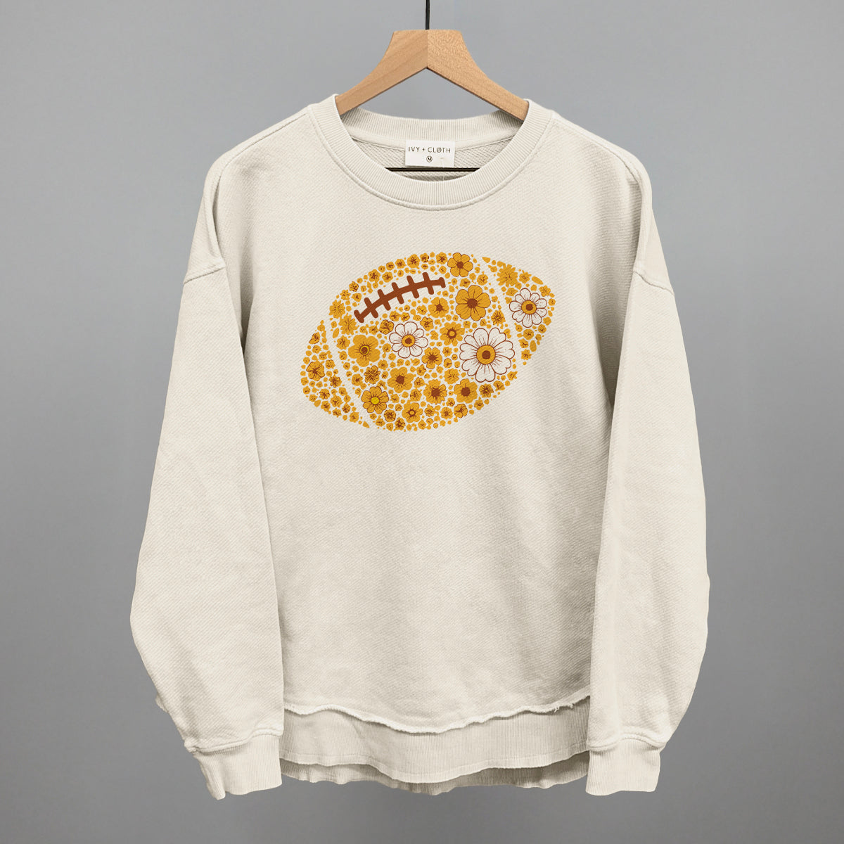 Yellow floral football design shown in tapioca