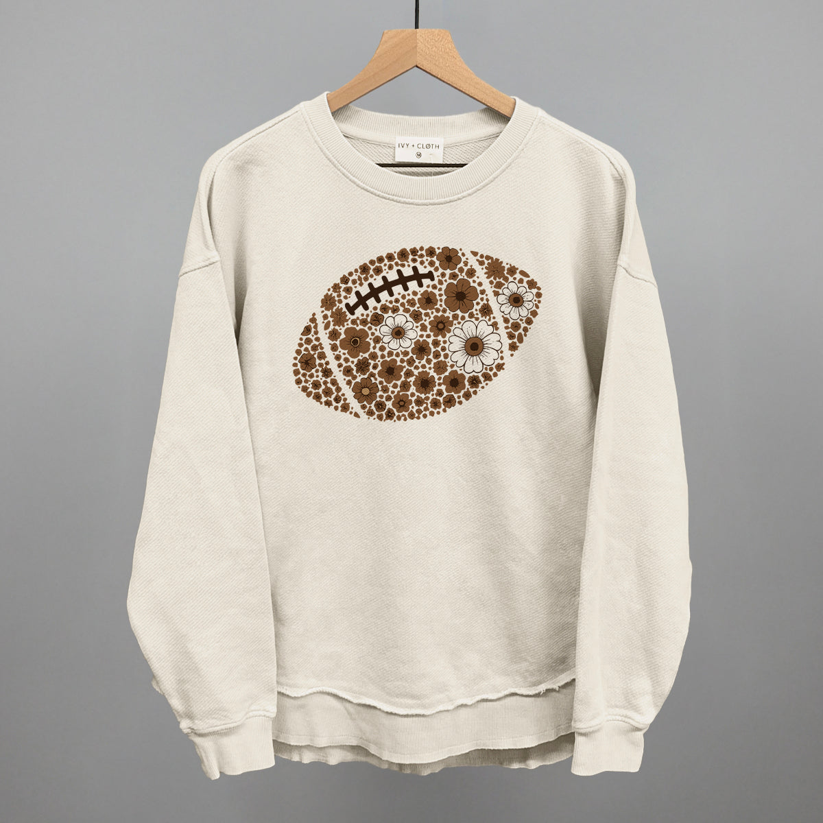 Brown floral football design shown in tapioca