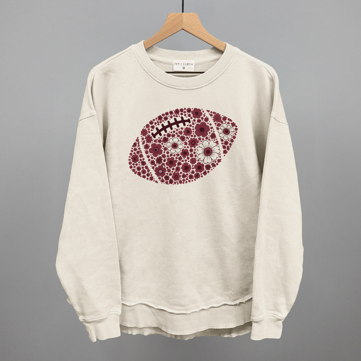 Maroon floral football design shown in tapioca