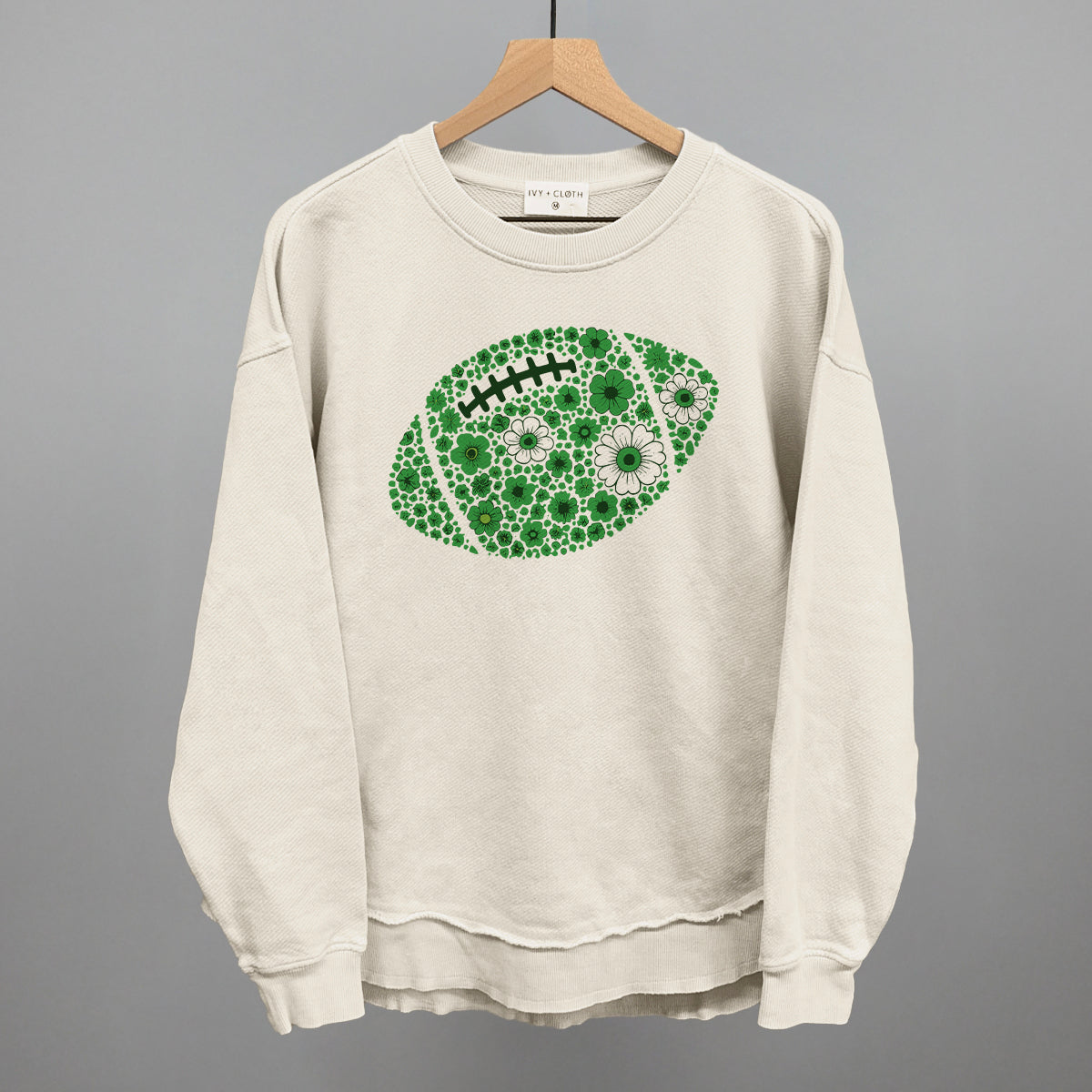 Green floral football design shown in tapioca