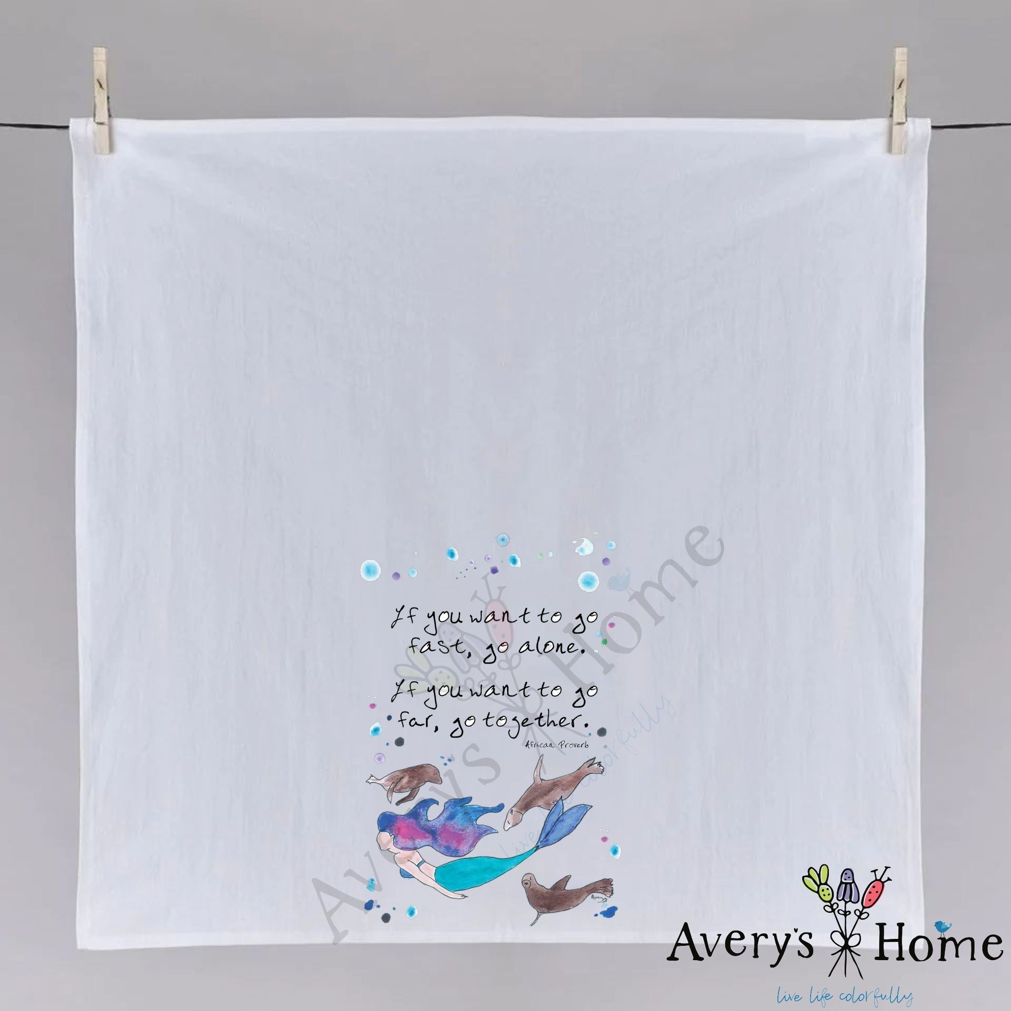 Mermaid and Seals dish towel hanging in the kitchen