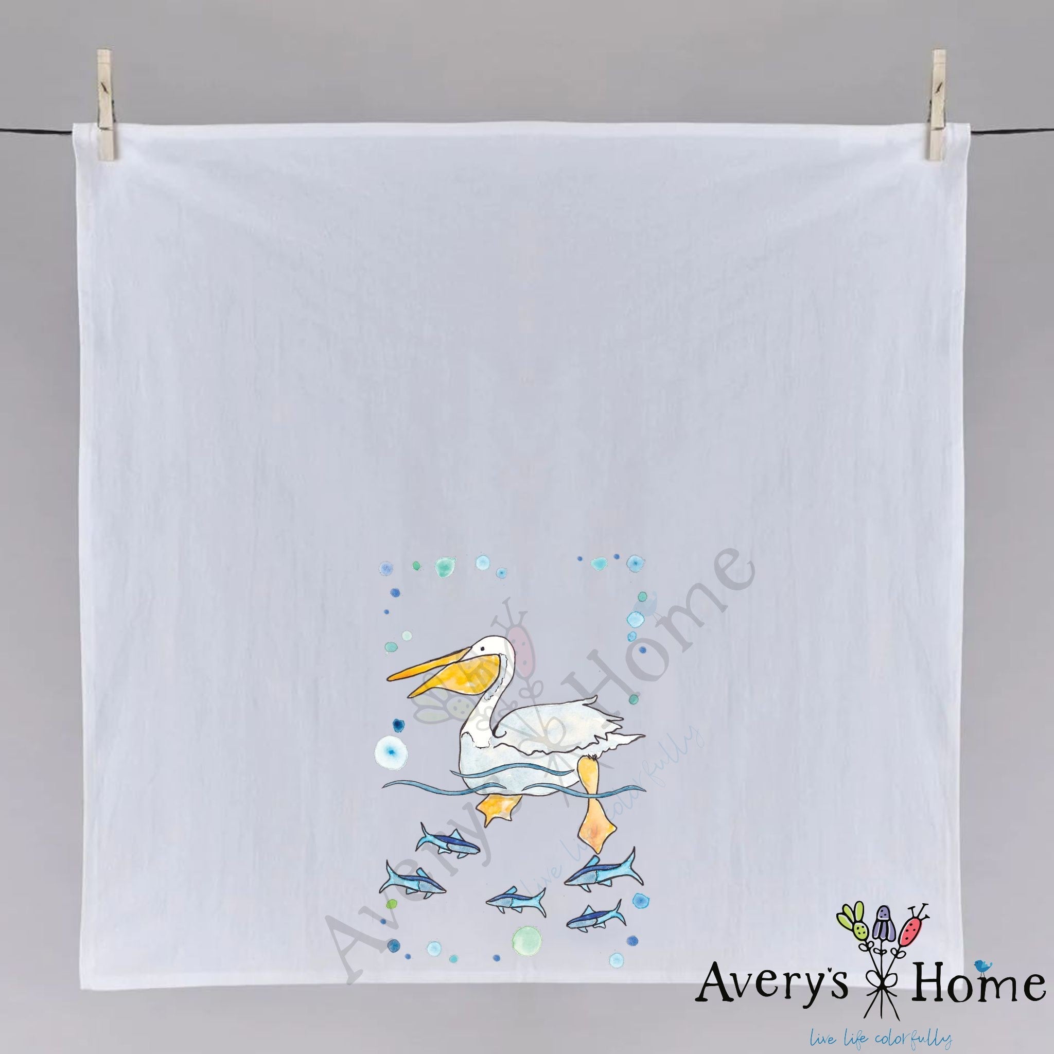 Pelican Swimming dish towel folded, hemmed on all four sides