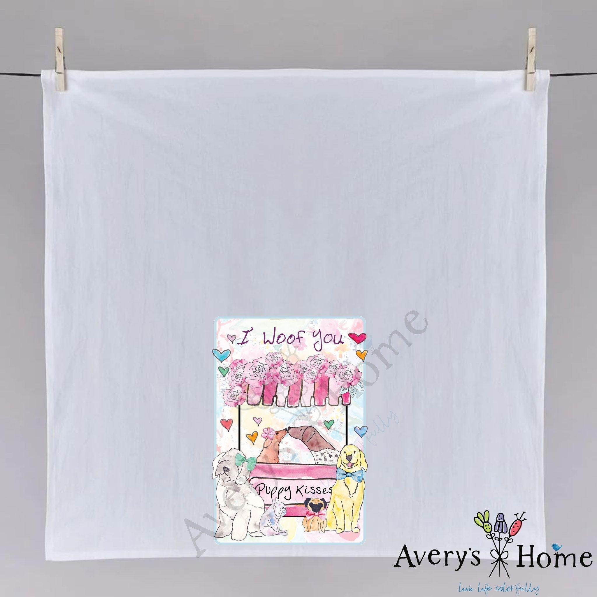 I Woof You Puppy Kisses dish towel hanging in the kitchen