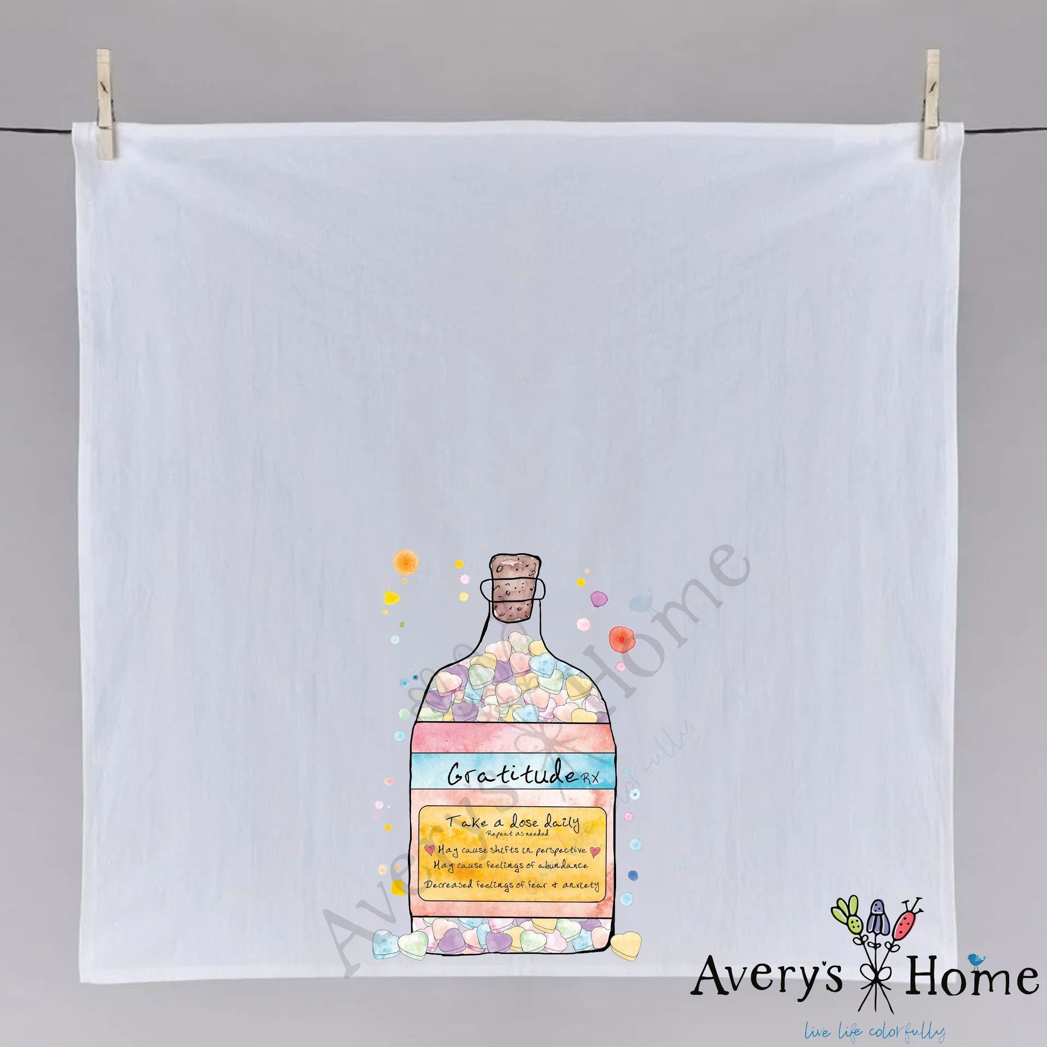 Gratitude In a Bottle dish towel hanging in the kitchen