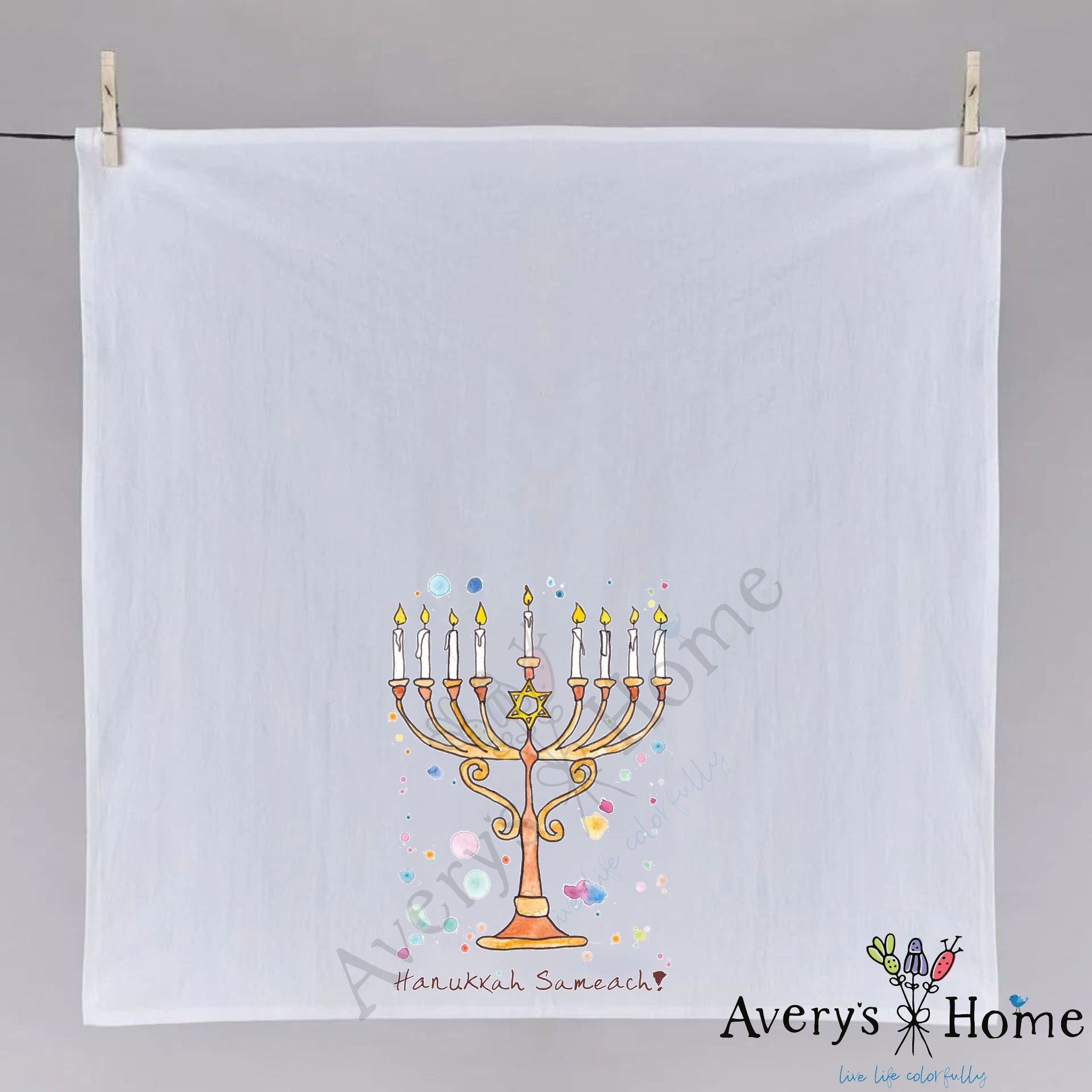 Happy Hanukkah dish towel hanging in the kitchen