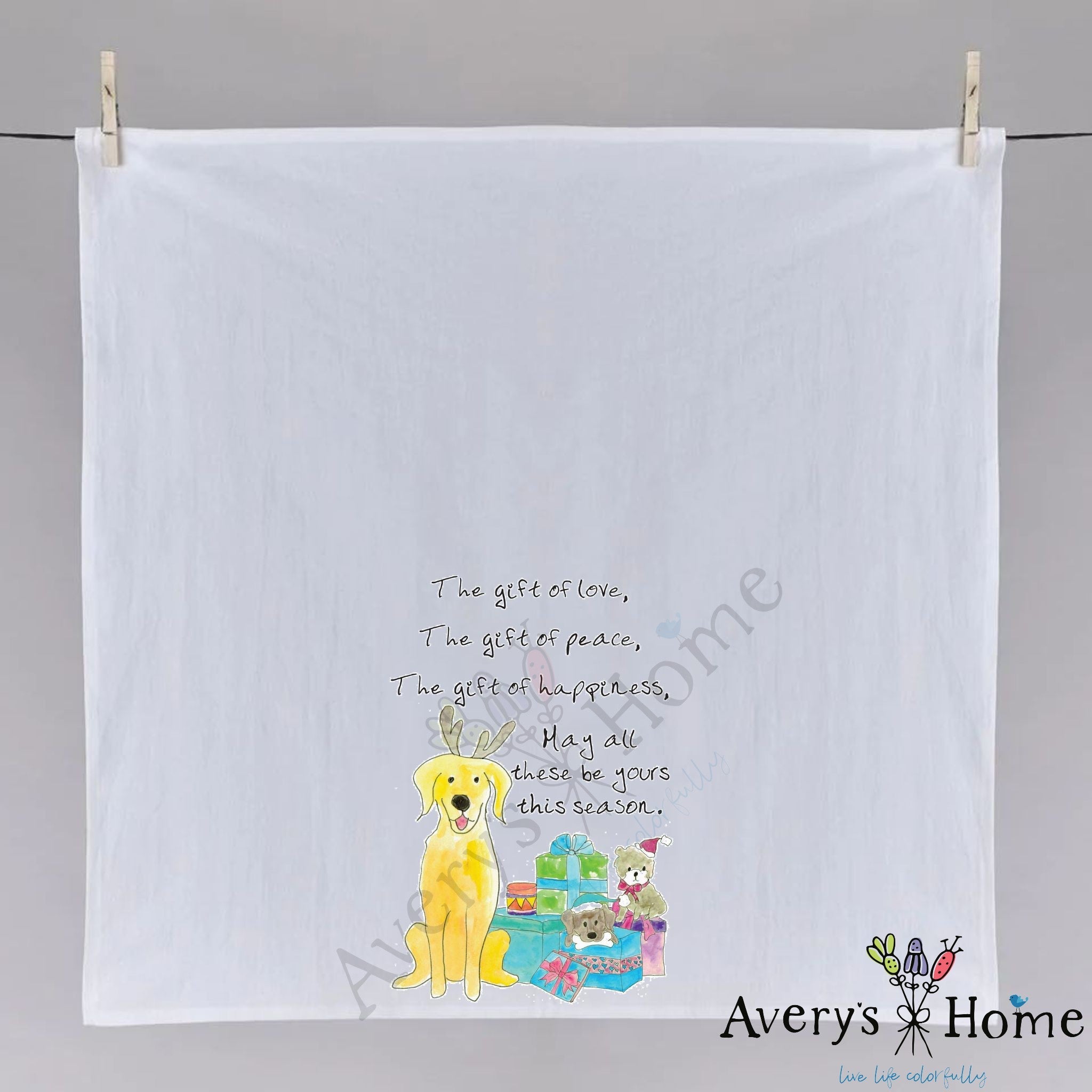 Christmas Gifts of Love, Peace, Happiness dish towel hanging in the kitchen