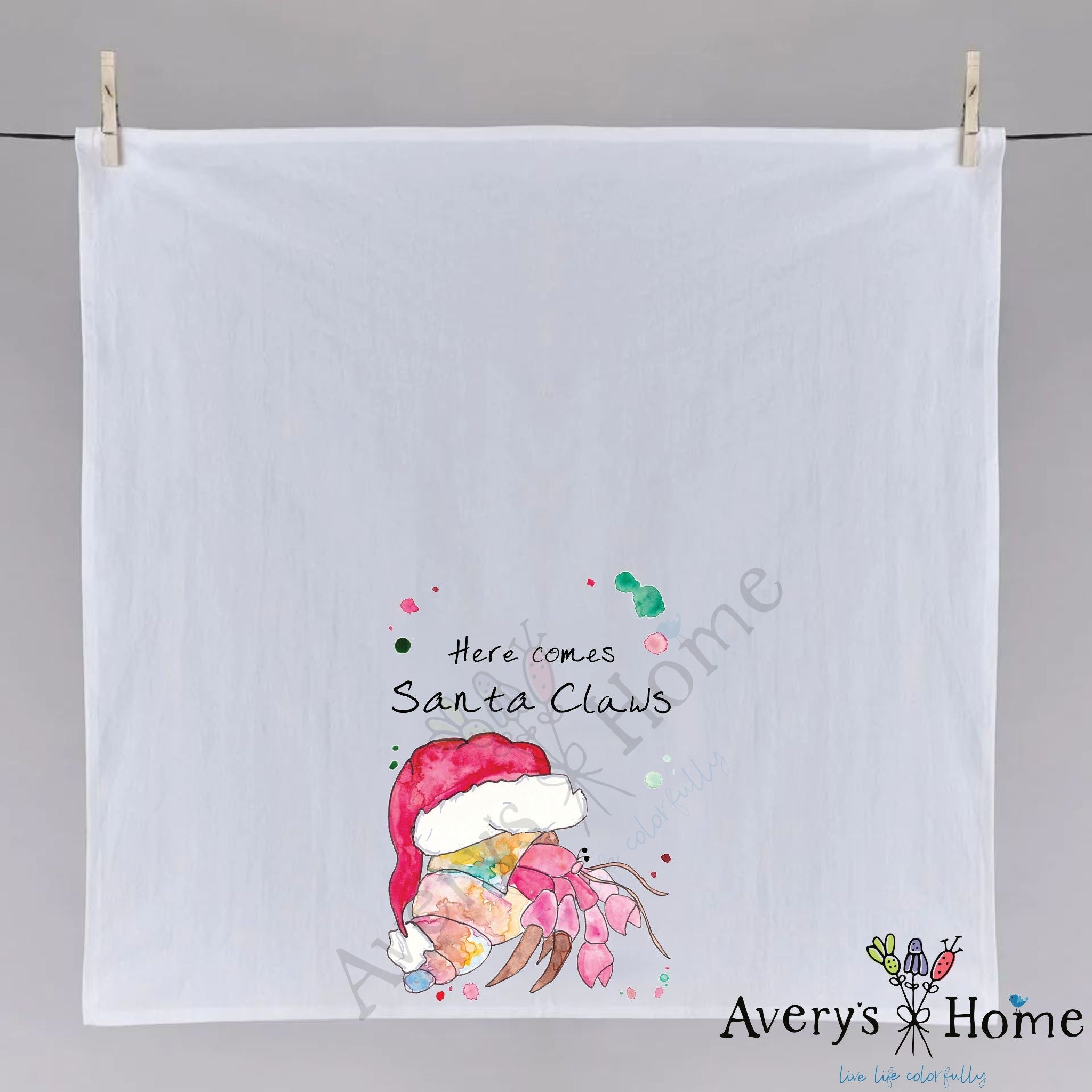 Santa Claws Christmas dish towel hanging in the kitchen