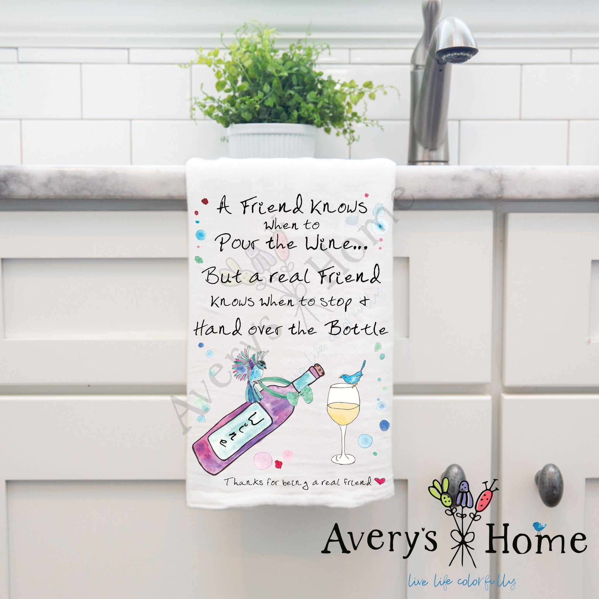 A Friend Pours the Wine dish towel hanging by kitchen sink