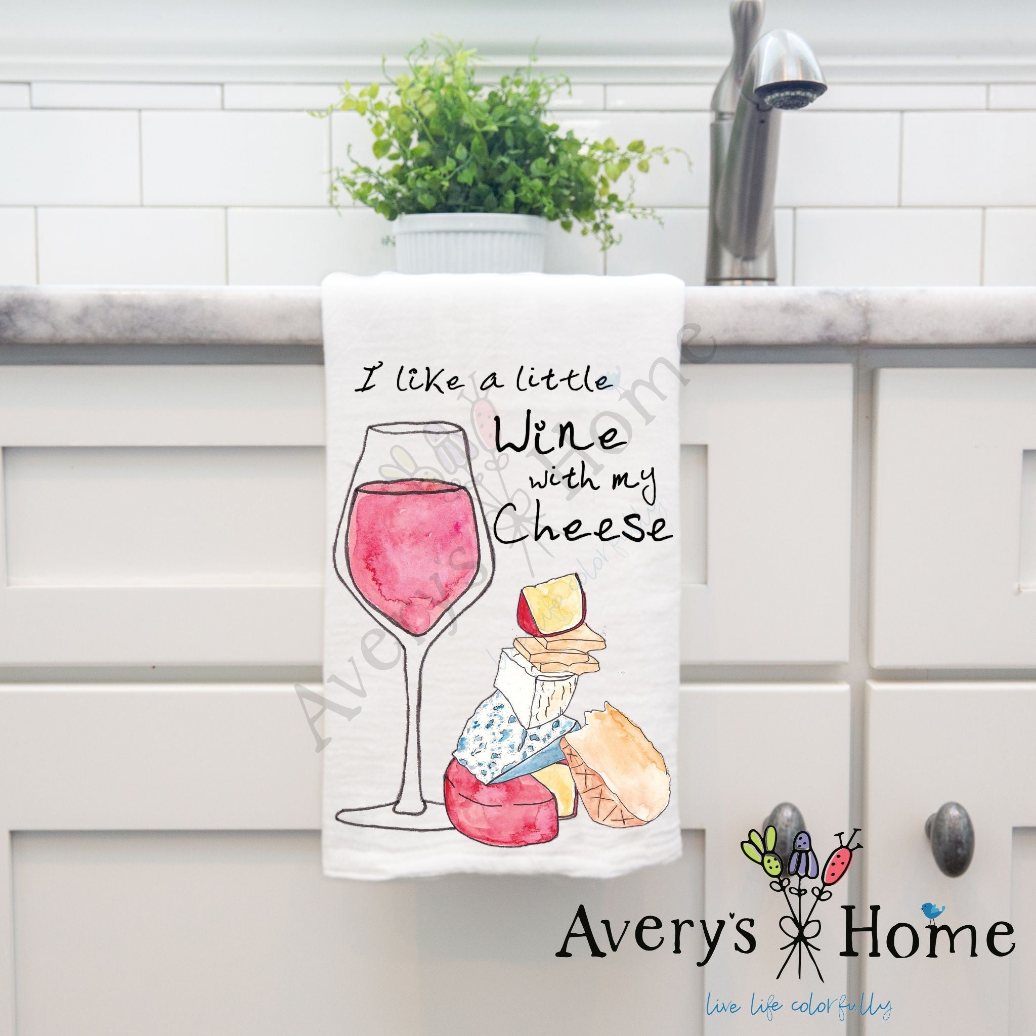 I Like a Little Wine with My Cheese dish towel hanging by kitchen sink