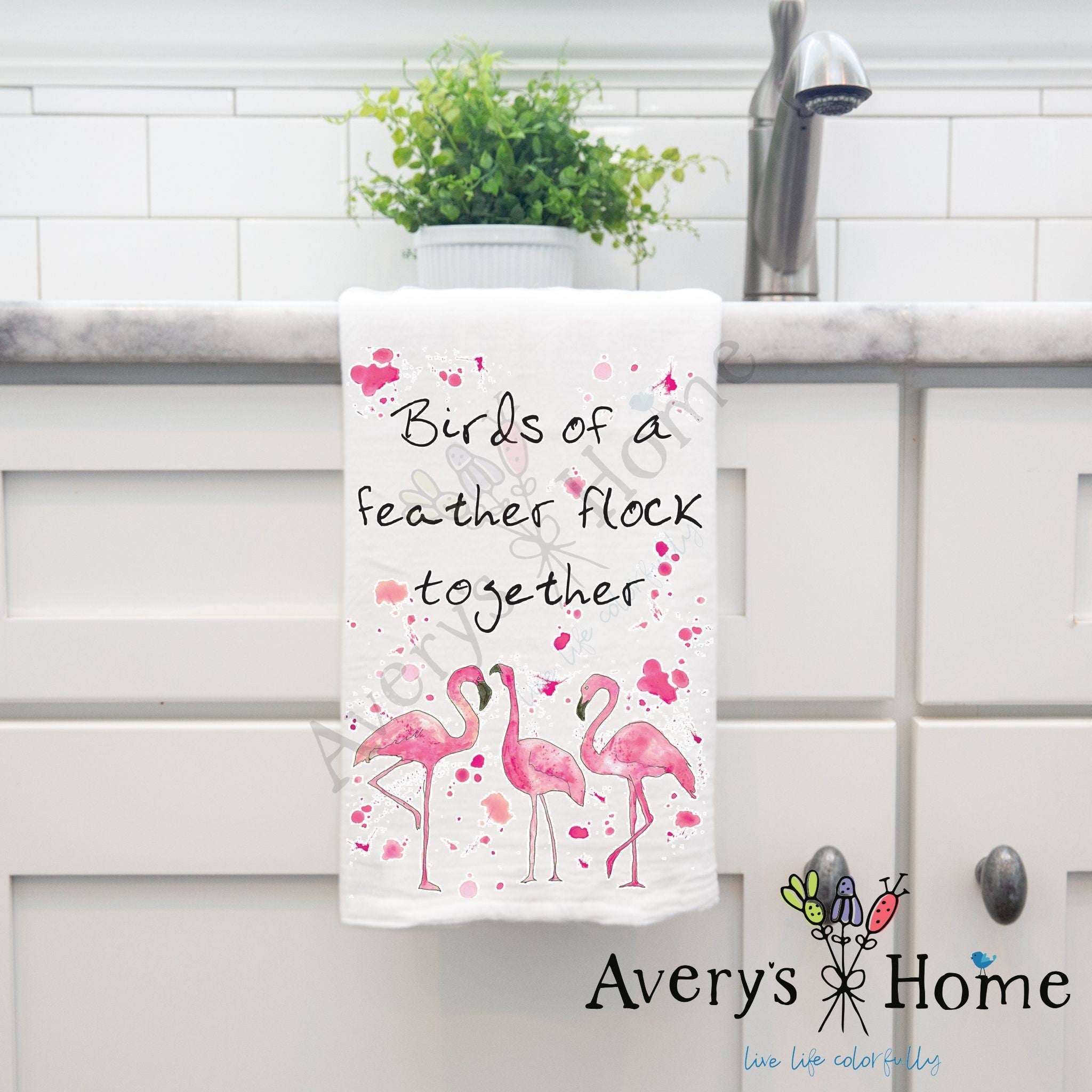 Birds of a Feather Flamingo dish towel hanging by kitchen sink