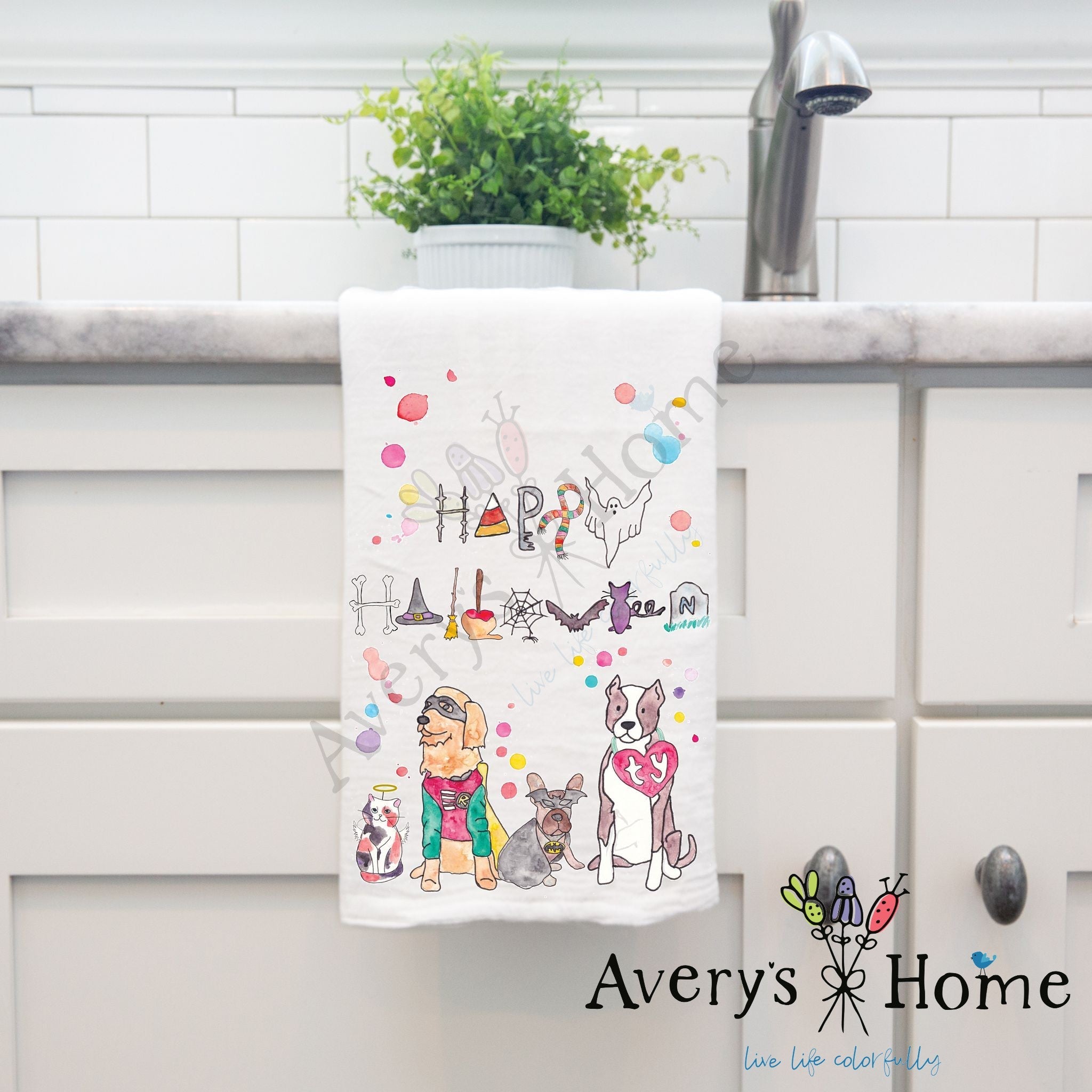 Happy Halloween dish towel hanging by kitchen sink