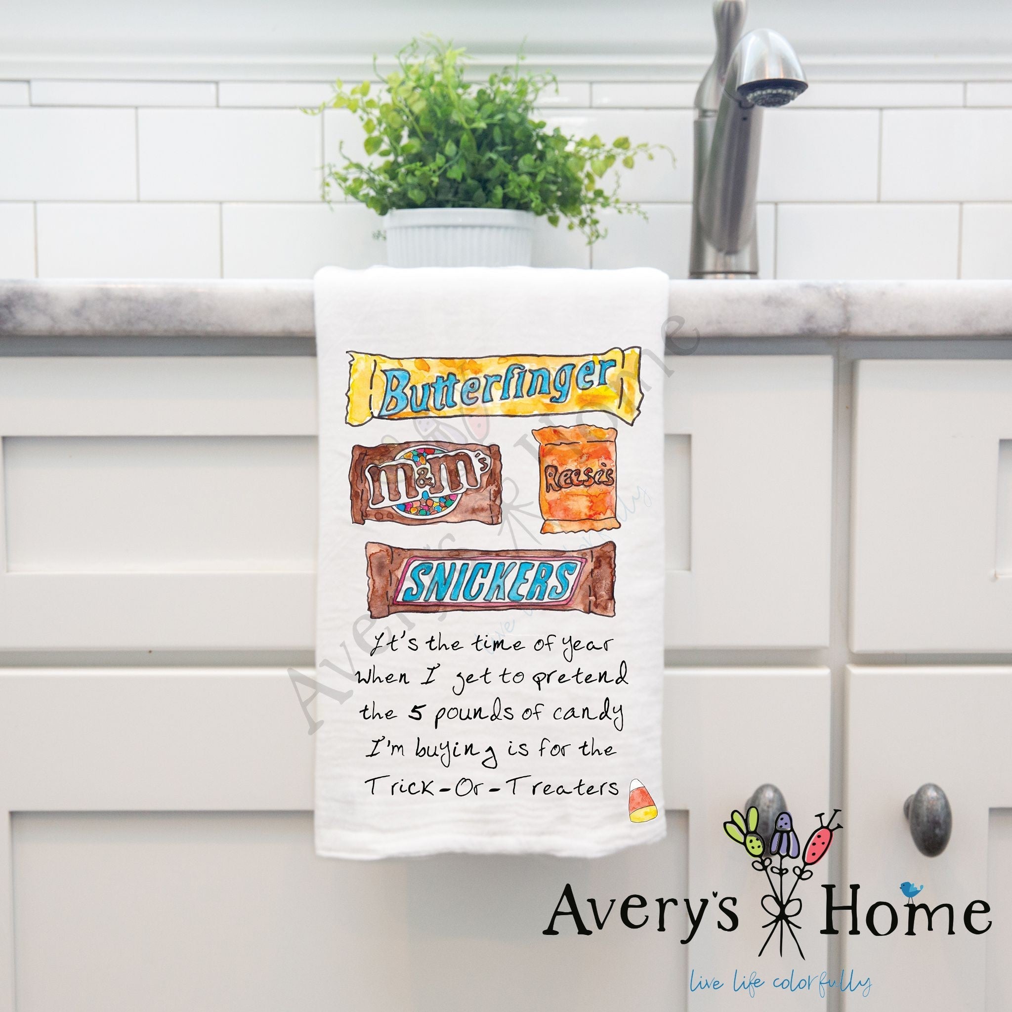 Candy for Halloween dish towel hanging by kitchen sink