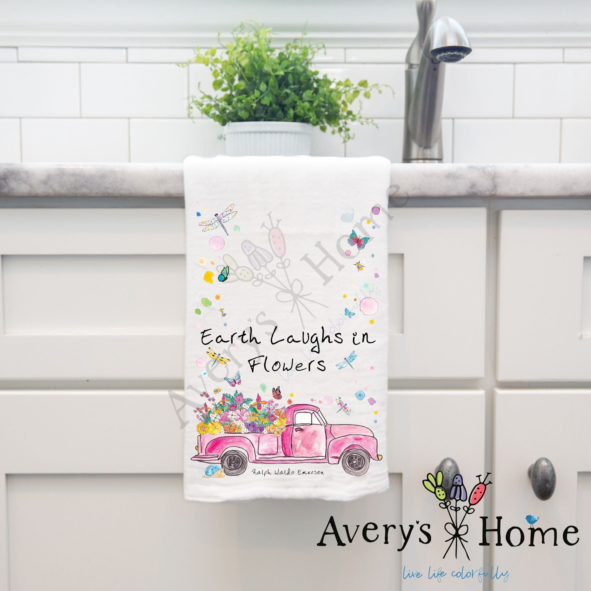 Earth Laughs in Flowers dish towel hanging by kitchen sink