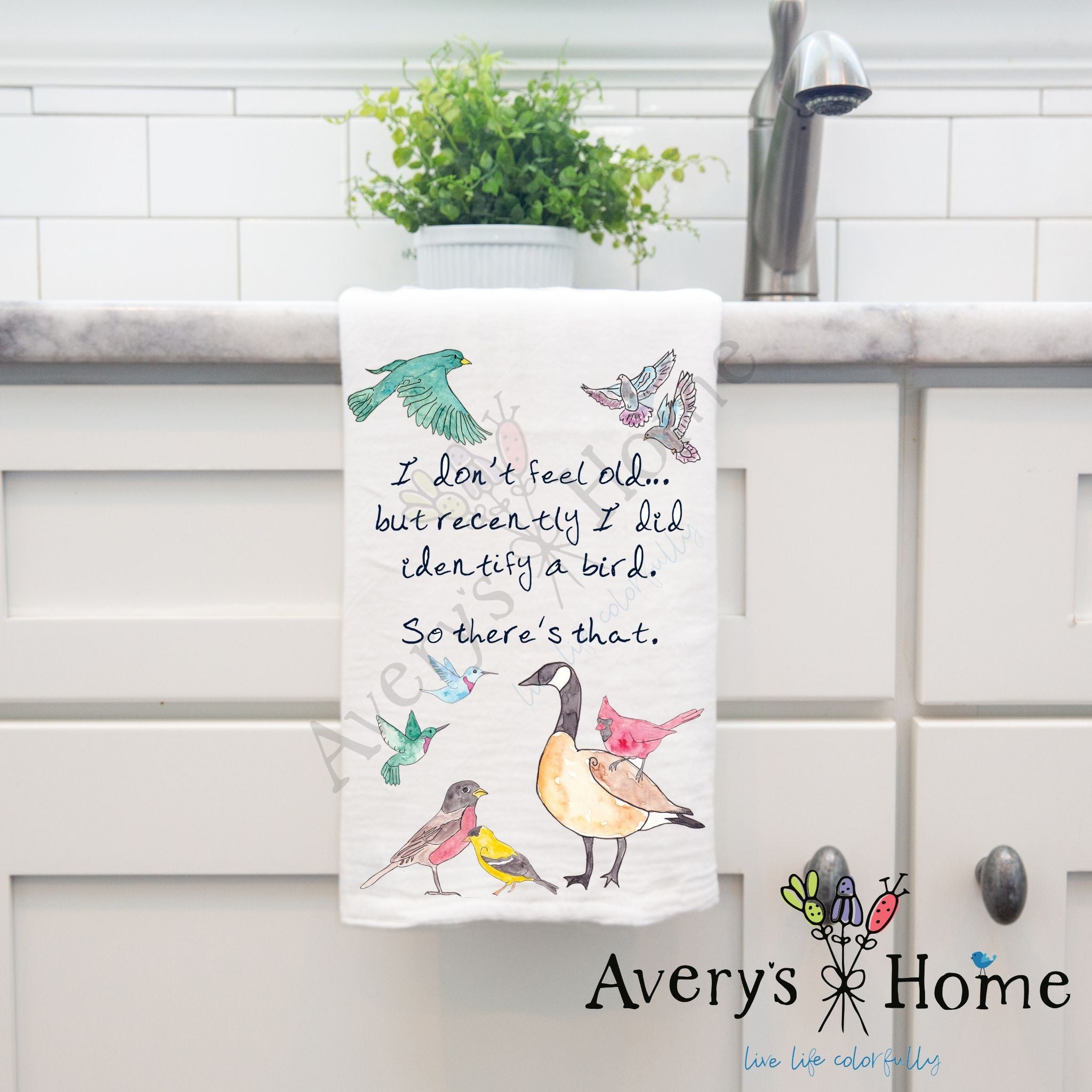 I Don't Feel Old Birds dish towel hanging by kitchen sink