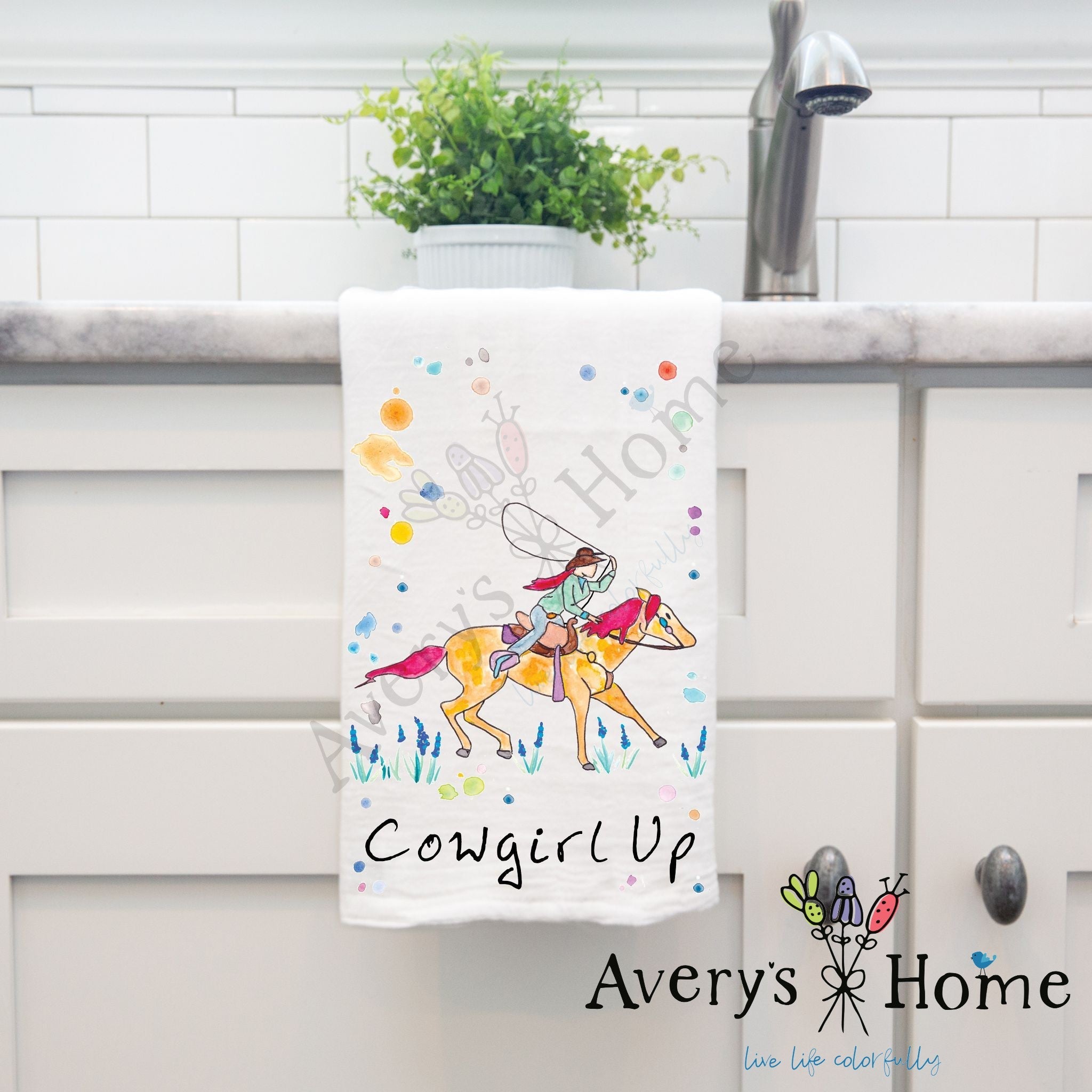 Cowgirl Up dish towel hanging in the kitchen