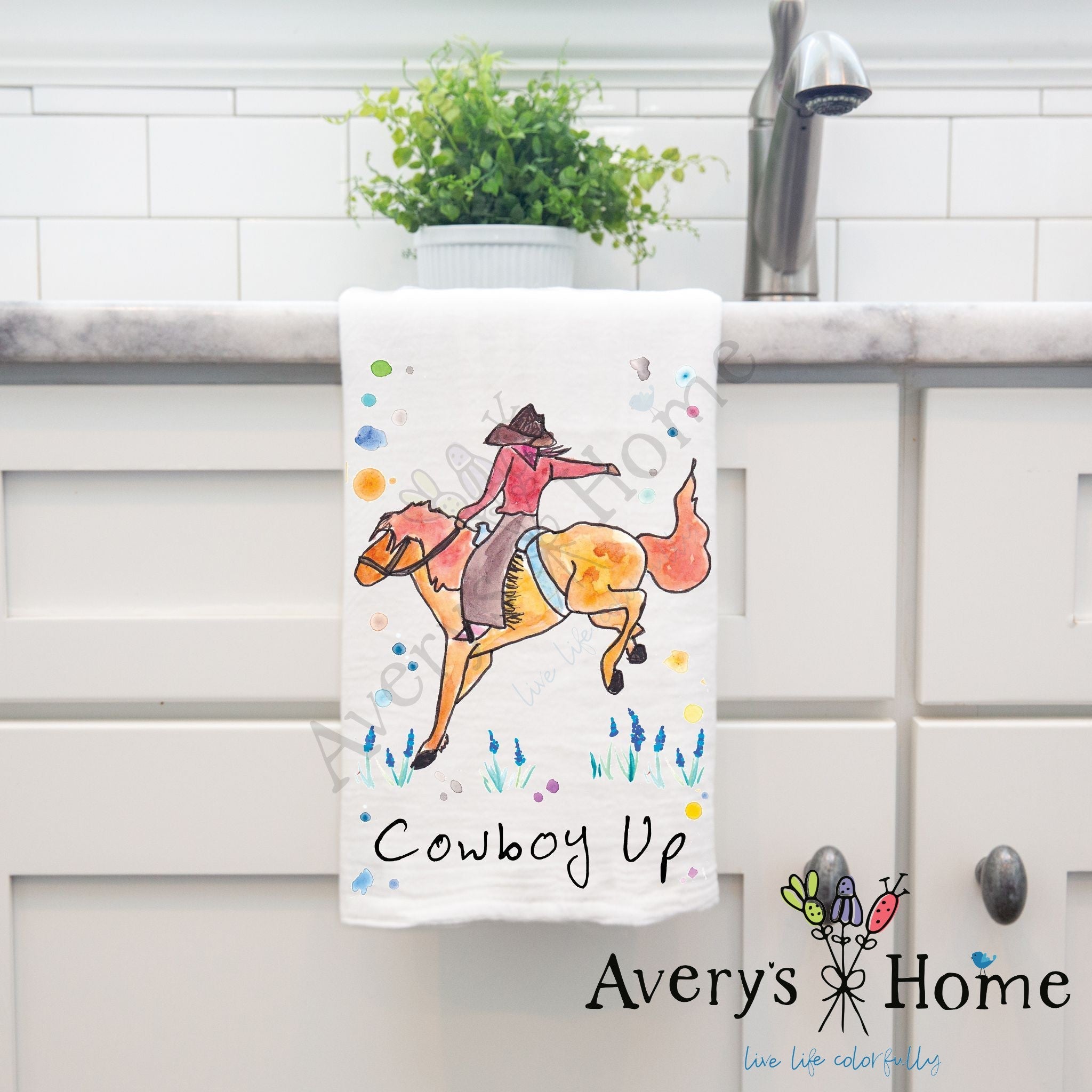 Cowboy Up dish towel hanging in the kitchen