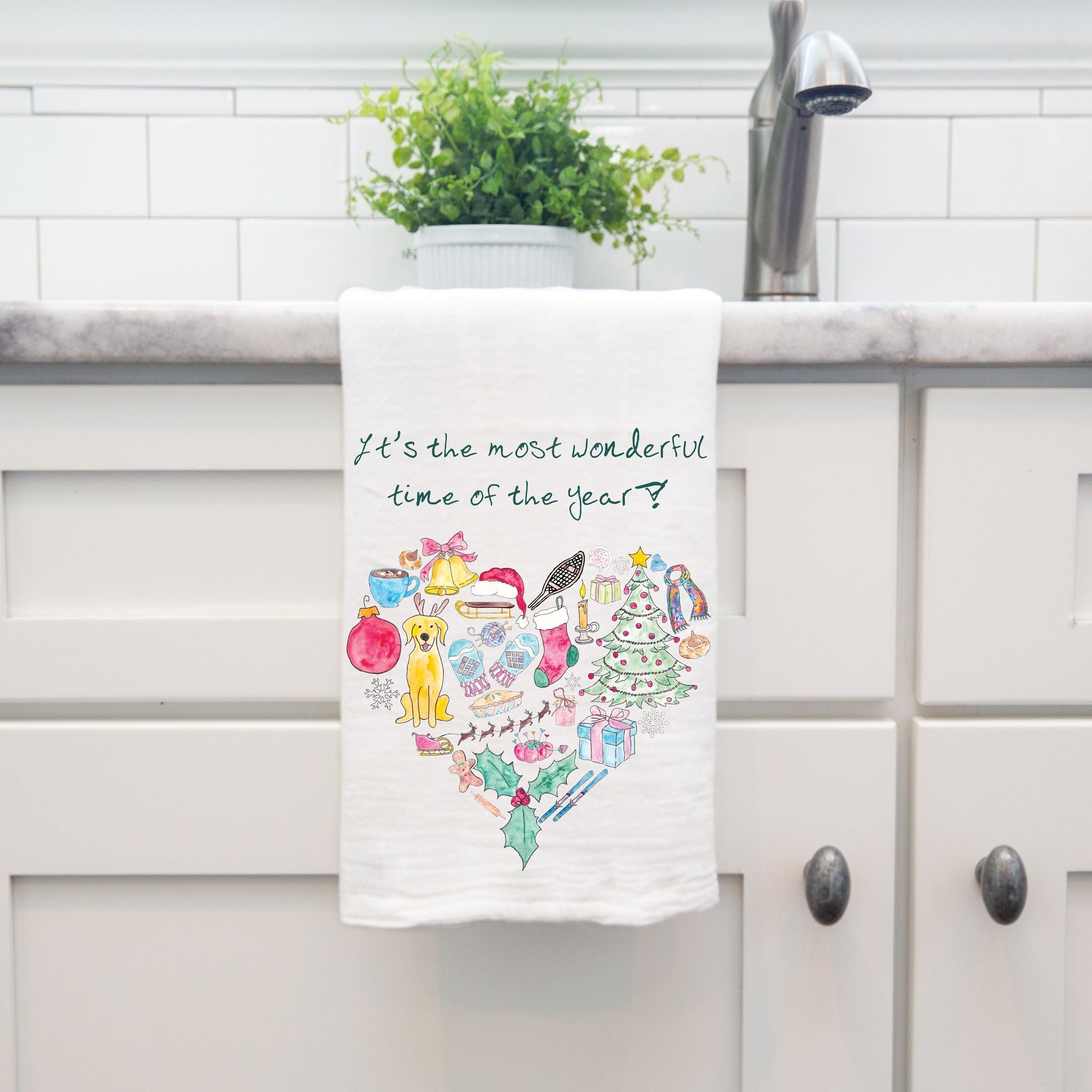 Christmas Time is Wonderful dish towel hanging by kitchen sink